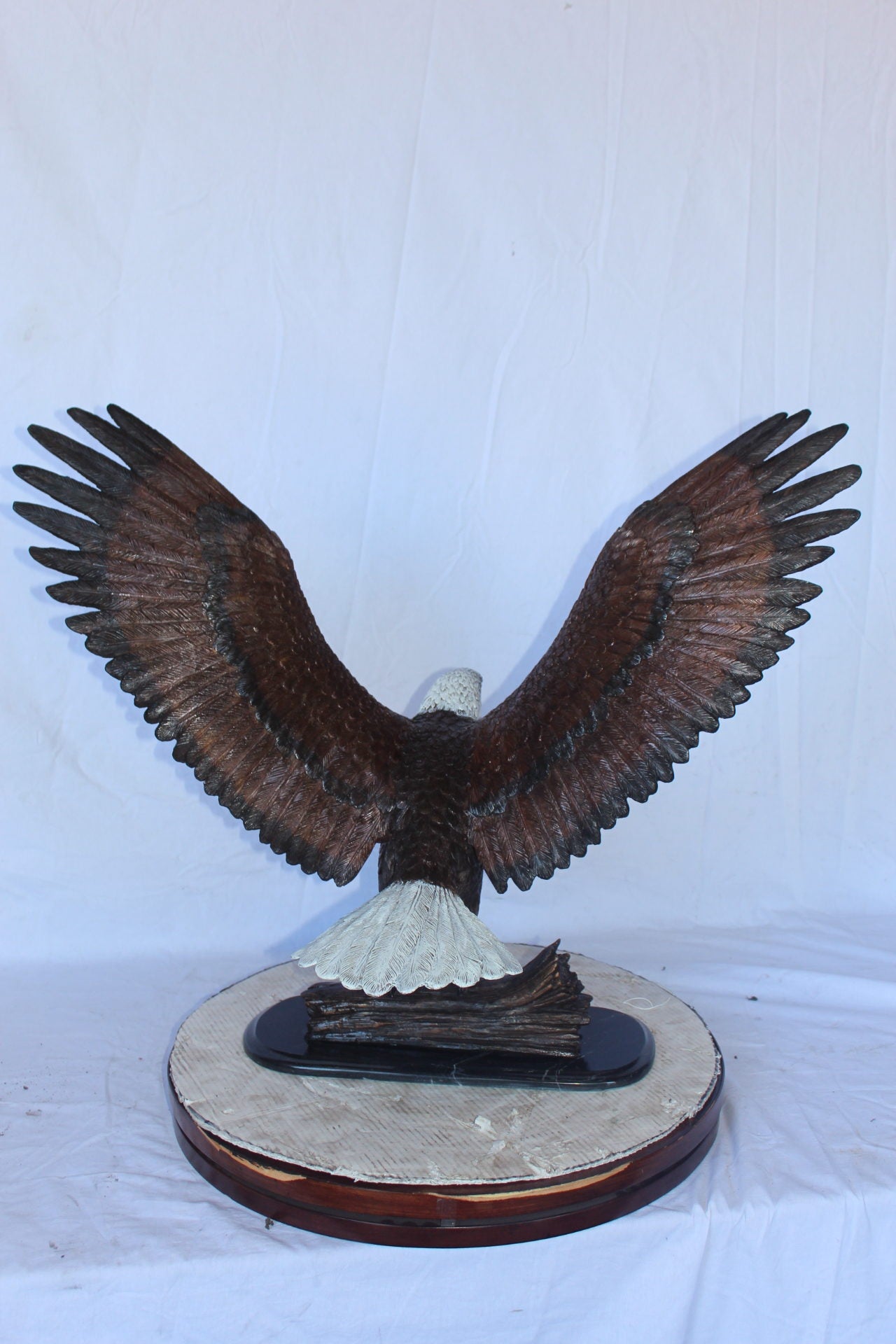 Perched eagle bronze statue - Size: 35"L x 21"W x 29"H.
