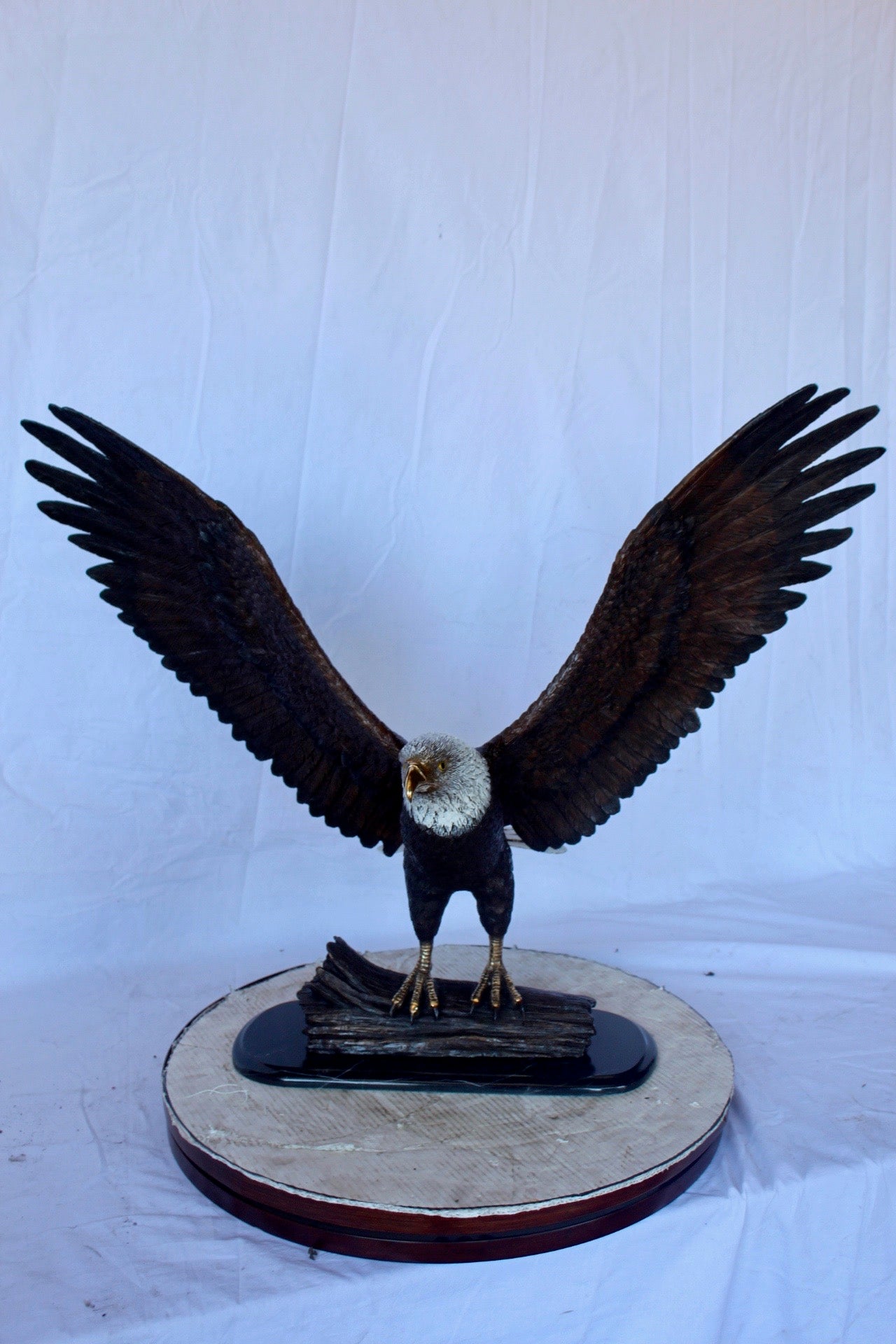 Perched eagle bronze statue - Size: 35"L x 21"W x 29"H.