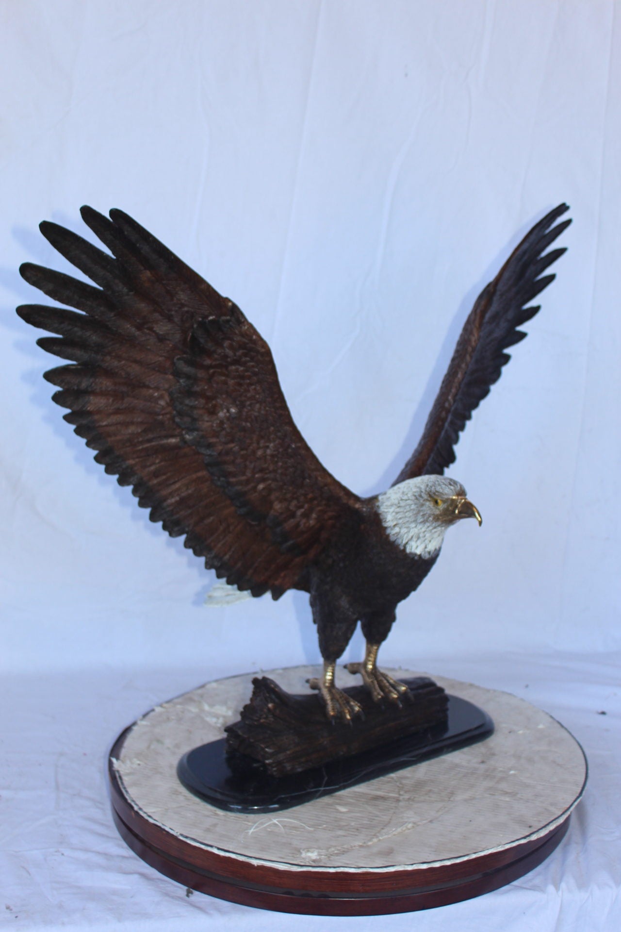 Perched eagle bronze statue - Size: 35"L x 21"W x 29"H.