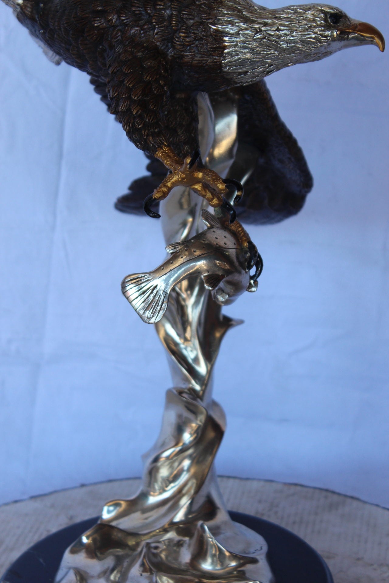 Soaring eagle carrying prey bronze statue - Size: 16"L x 23"W x 39"H.