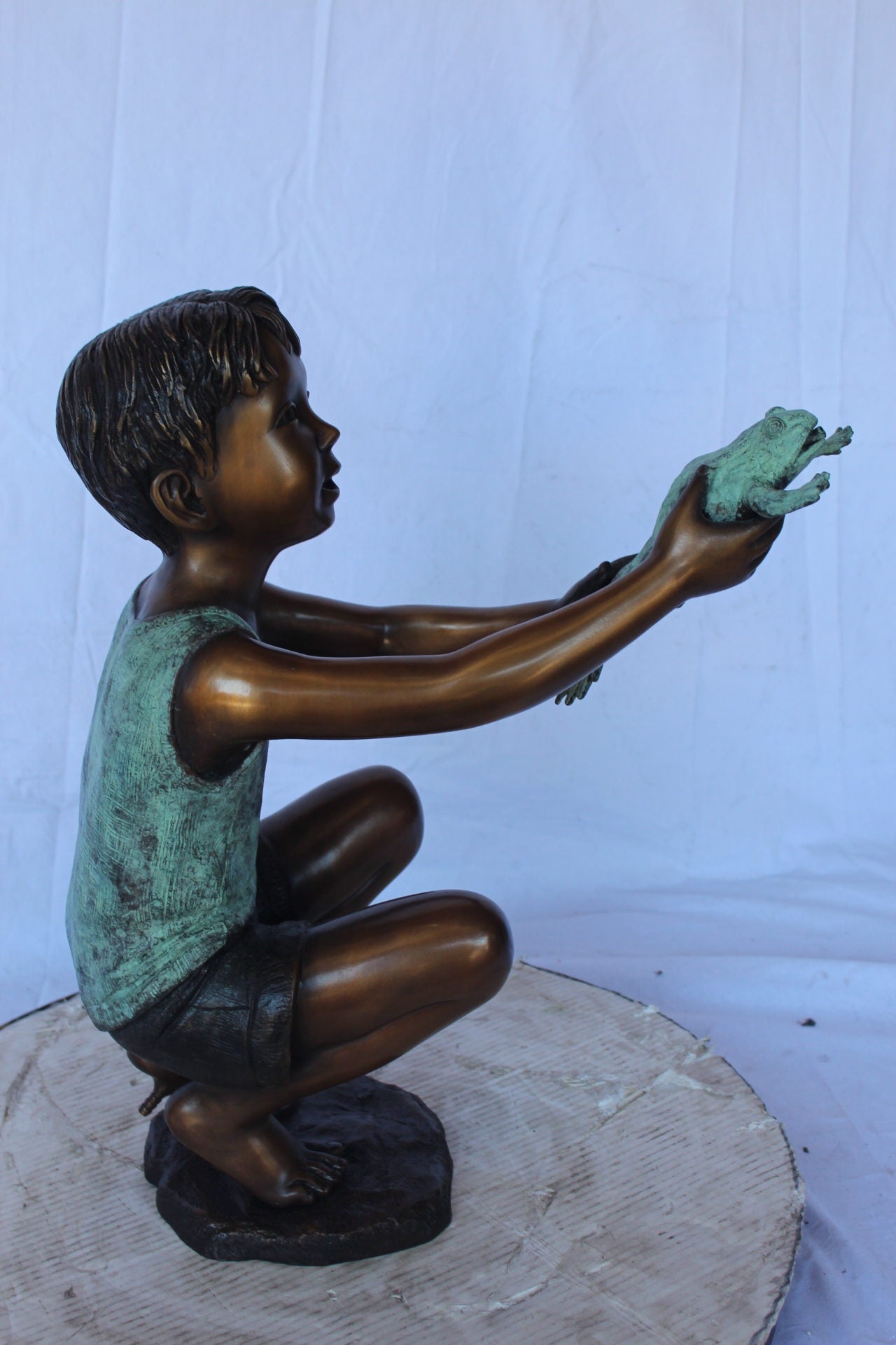 Young boy holding a frog bronze statue fountain - Size: 18"L x 10"W x 22"H.
