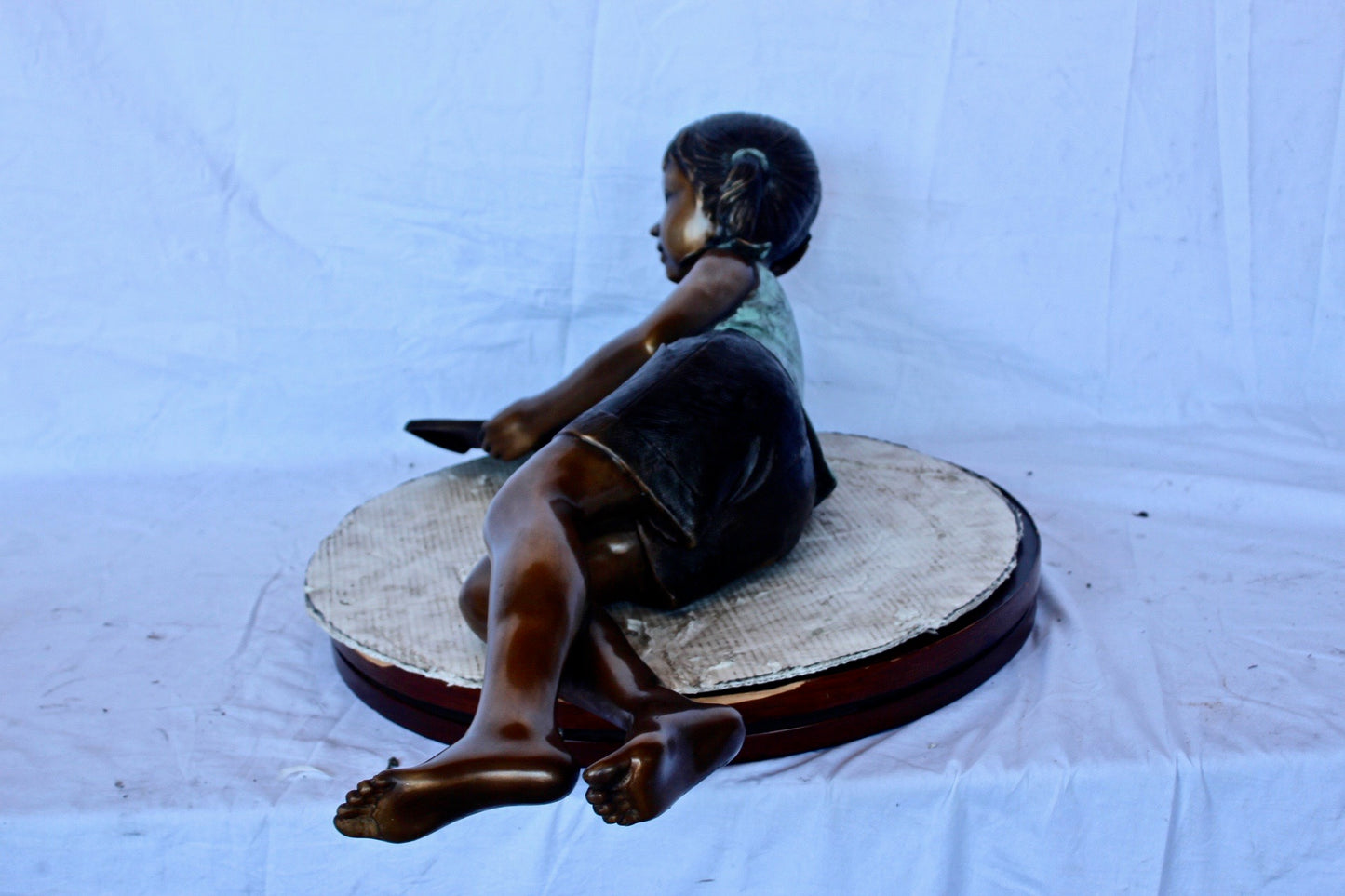 Nifao Bronze Girl Reading on Ground Statue – Hand-Cast Lost Wax Outdoor Sculpture with Book, Patina Finish - 40" L x 17" W x 13" H.