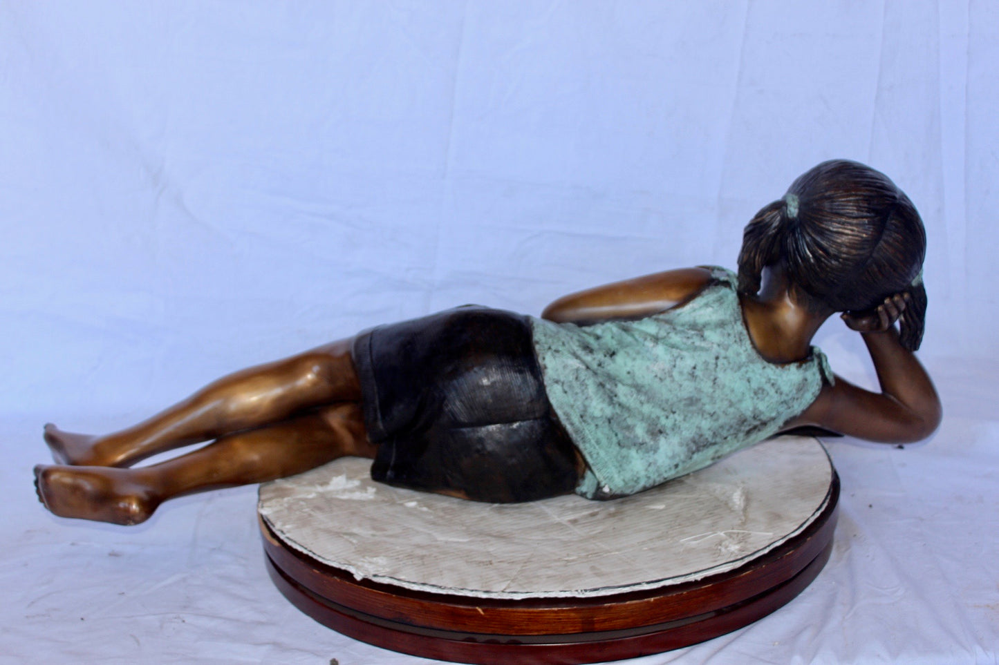 Nifao Bronze Girl Reading on Ground Statue – Hand-Cast Lost Wax Outdoor Sculpture with Book, Patina Finish - 40" L x 17" W x 13" H.