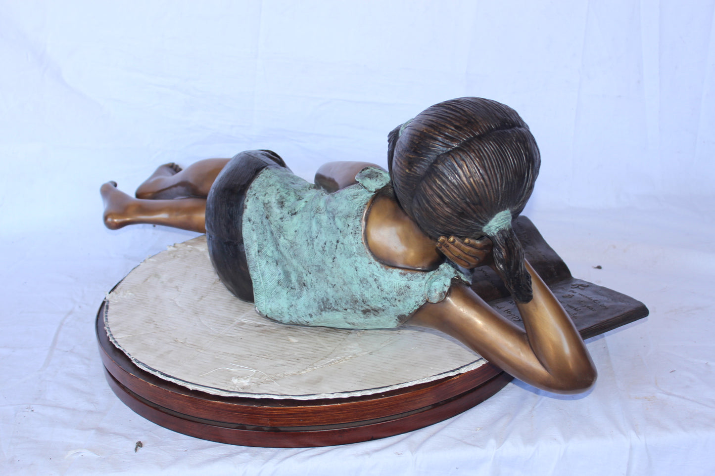 Nifao Bronze Girl Reading on Ground Statue – Hand-Cast Lost Wax Outdoor Sculpture with Book, Patina Finish - 40" L x 17" W x 13" H.