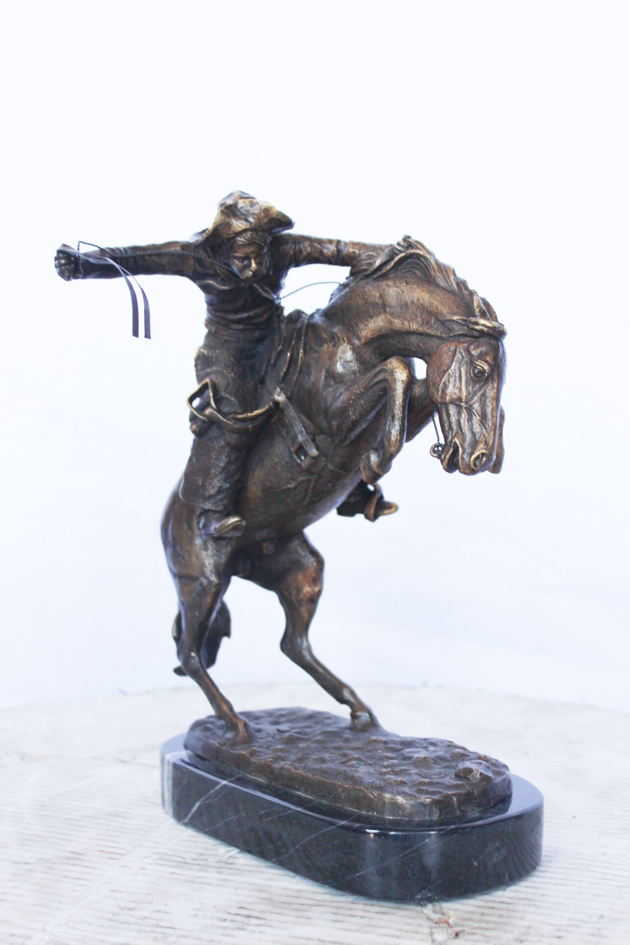 Remington replica Bronco Buster bronze statue - Size: 8"L x 10"W x 12"H.