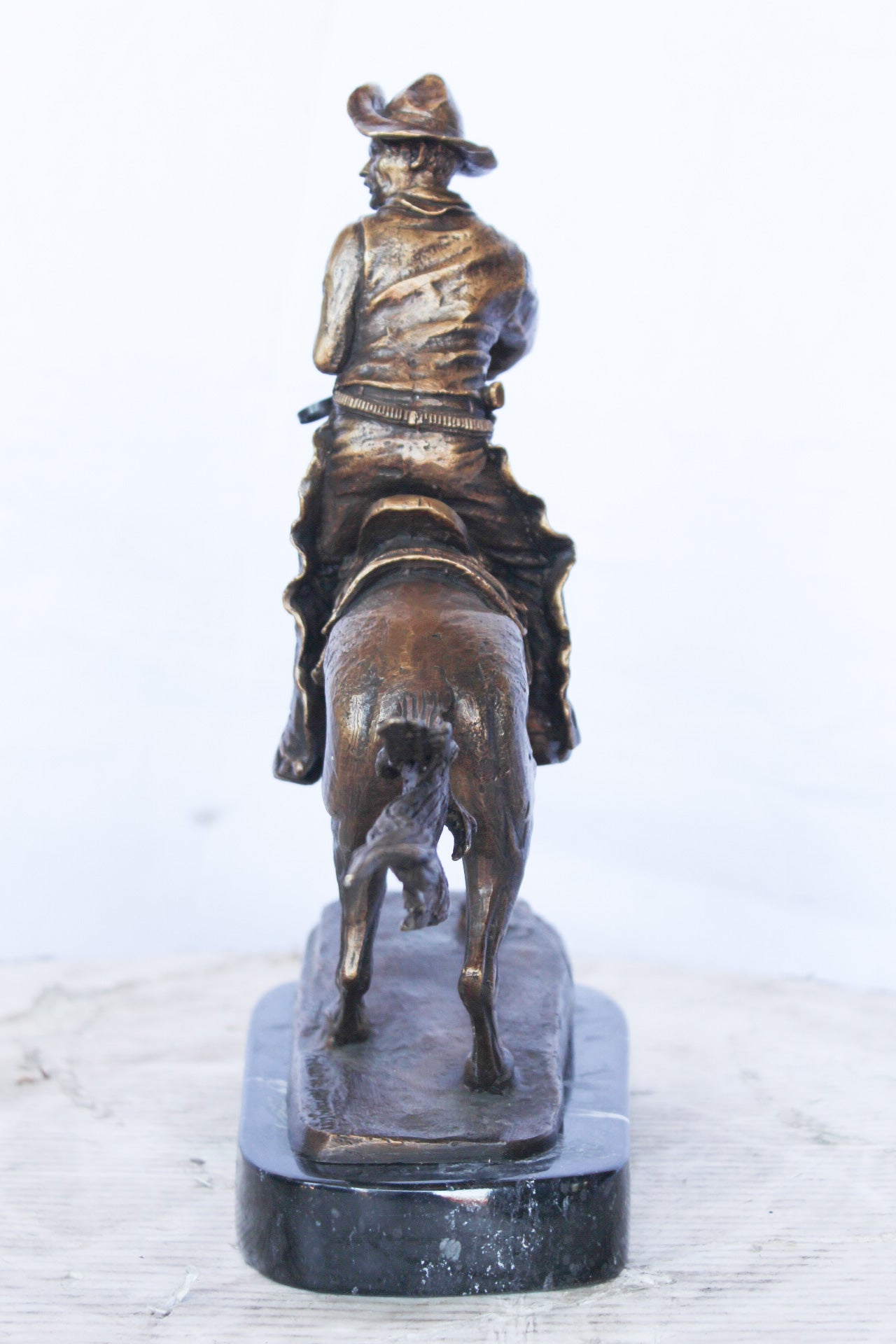 Remington replica Cowboy bronze statue - Size: 5"L x 15"W x 13"H.