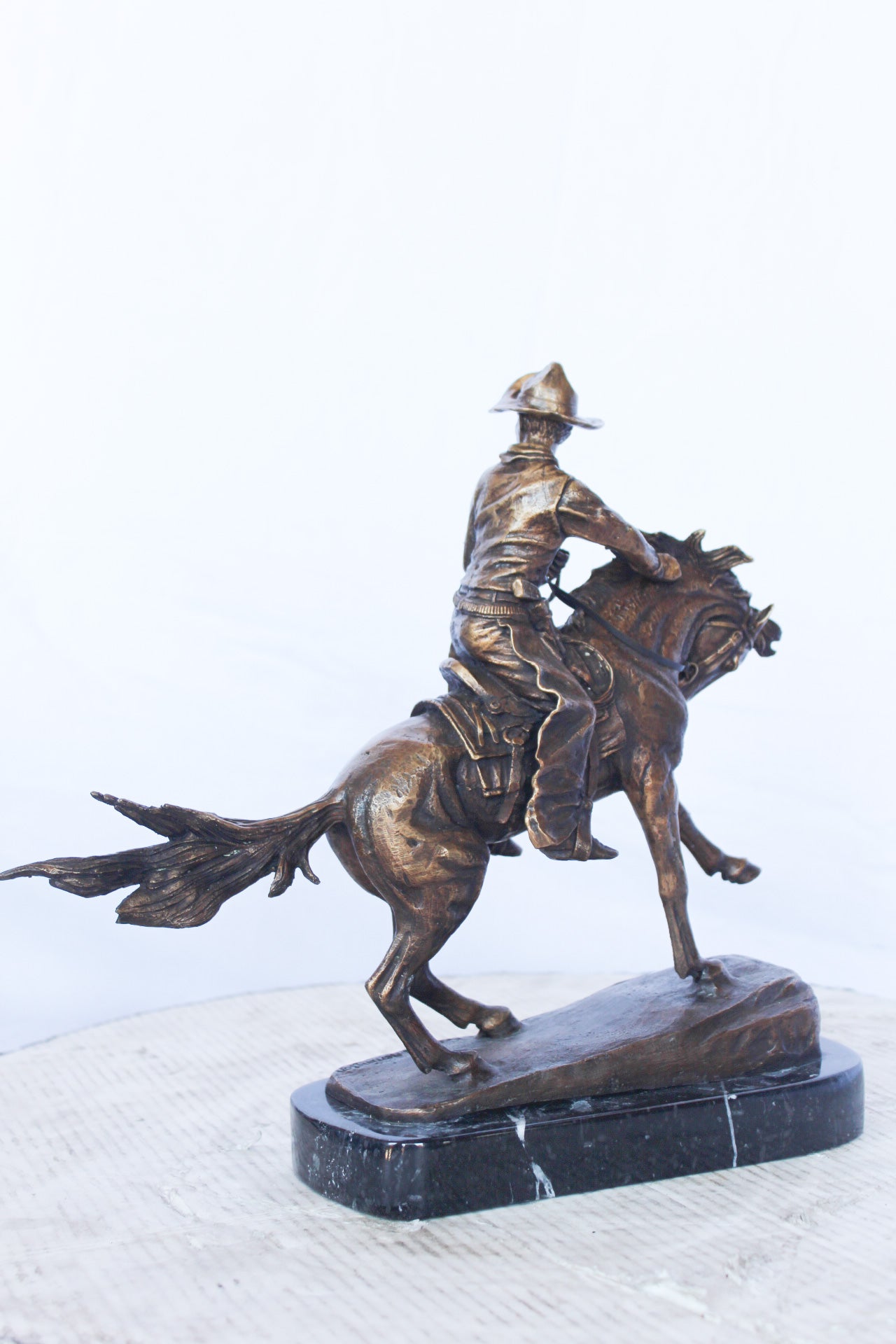 Remington replica Cowboy bronze statue - Size: 5"L x 15"W x 13"H.