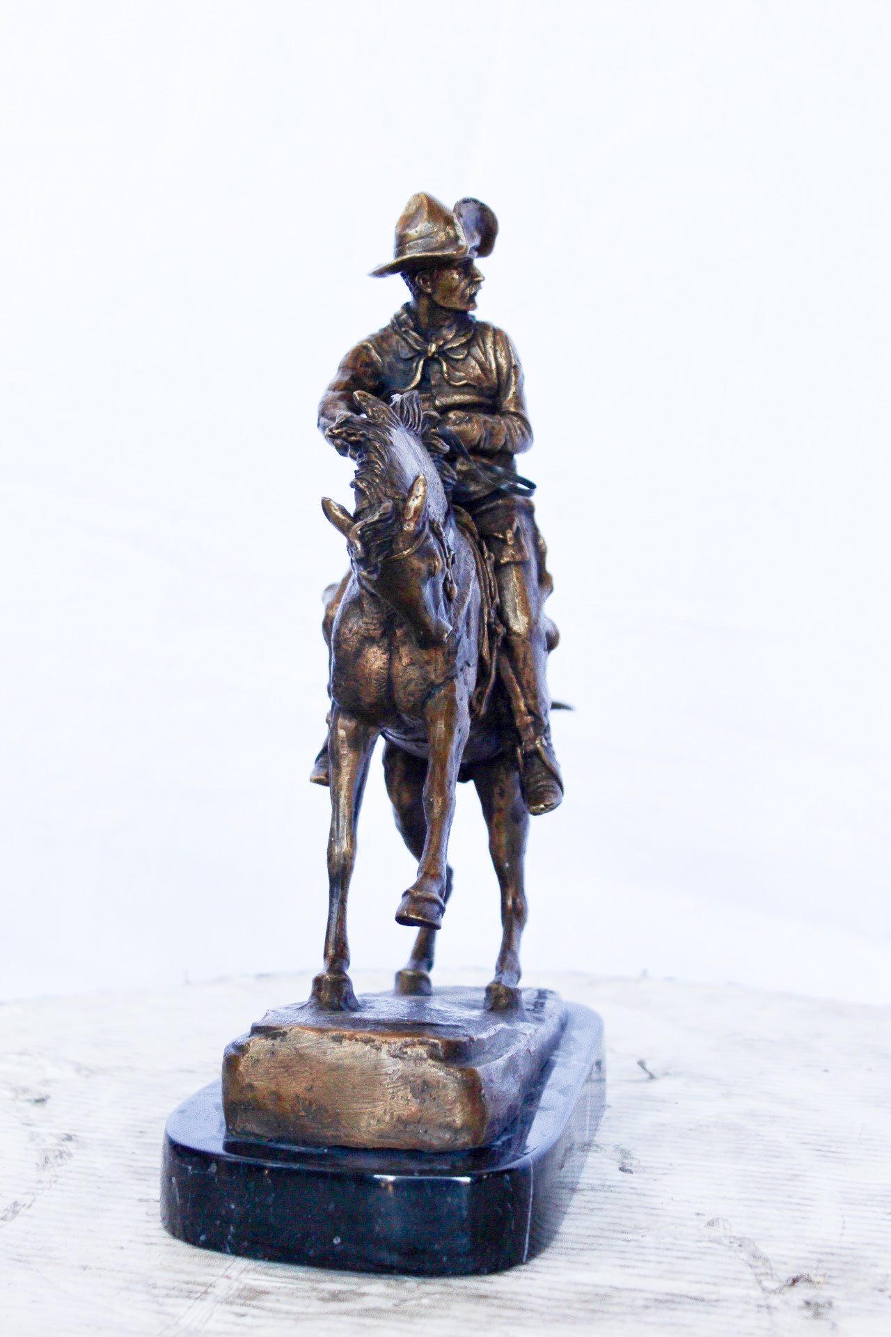 Remington replica Cowboy bronze statue - Size: 5"L x 15"W x 13"H.