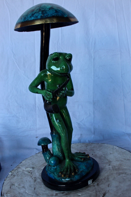 Jazzy frog perched under mushroom bronze statue   -  Size: 10"L x 10"W x 28"H.