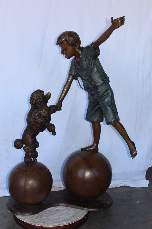 Boy and poodle balancing circus stars bronze statue -  Size: 38" x 27" x 55"H.