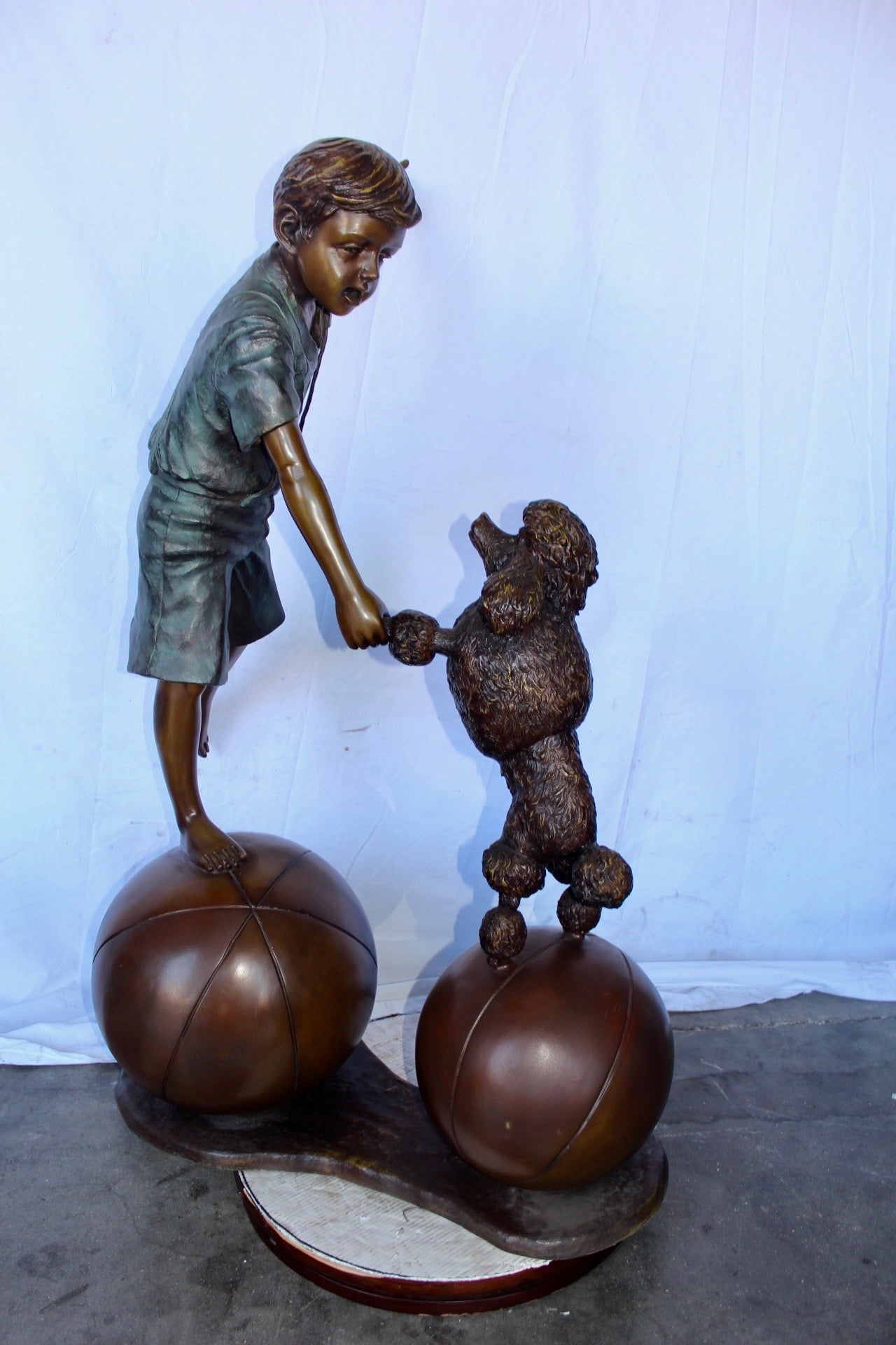 Boy and poodle balancing circus stars bronze statue - Size: 38" x 27" x 55"H.