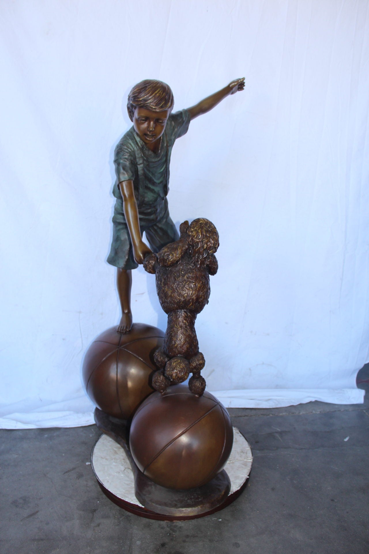 Boy and poodle balancing circus stars bronze statue - Size: 38" x 27" x 55"H.