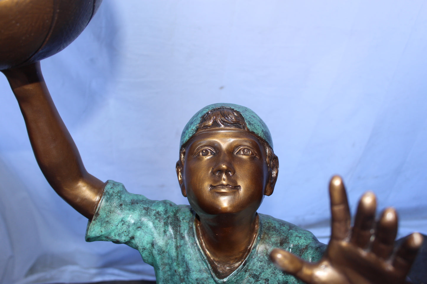 A young boy scoring a basket bronze statue -  Size: 19"L x 20"W x 61"H.