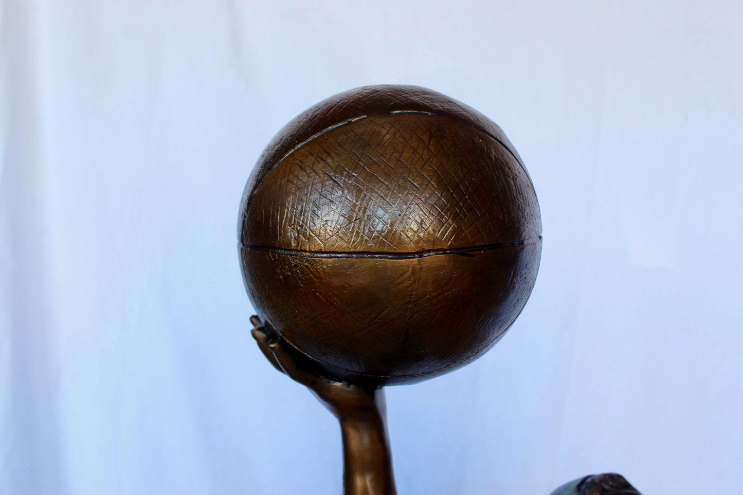 A young boy scoring a basket bronze statue -  Size: 19"L x 20"W x 61"H.