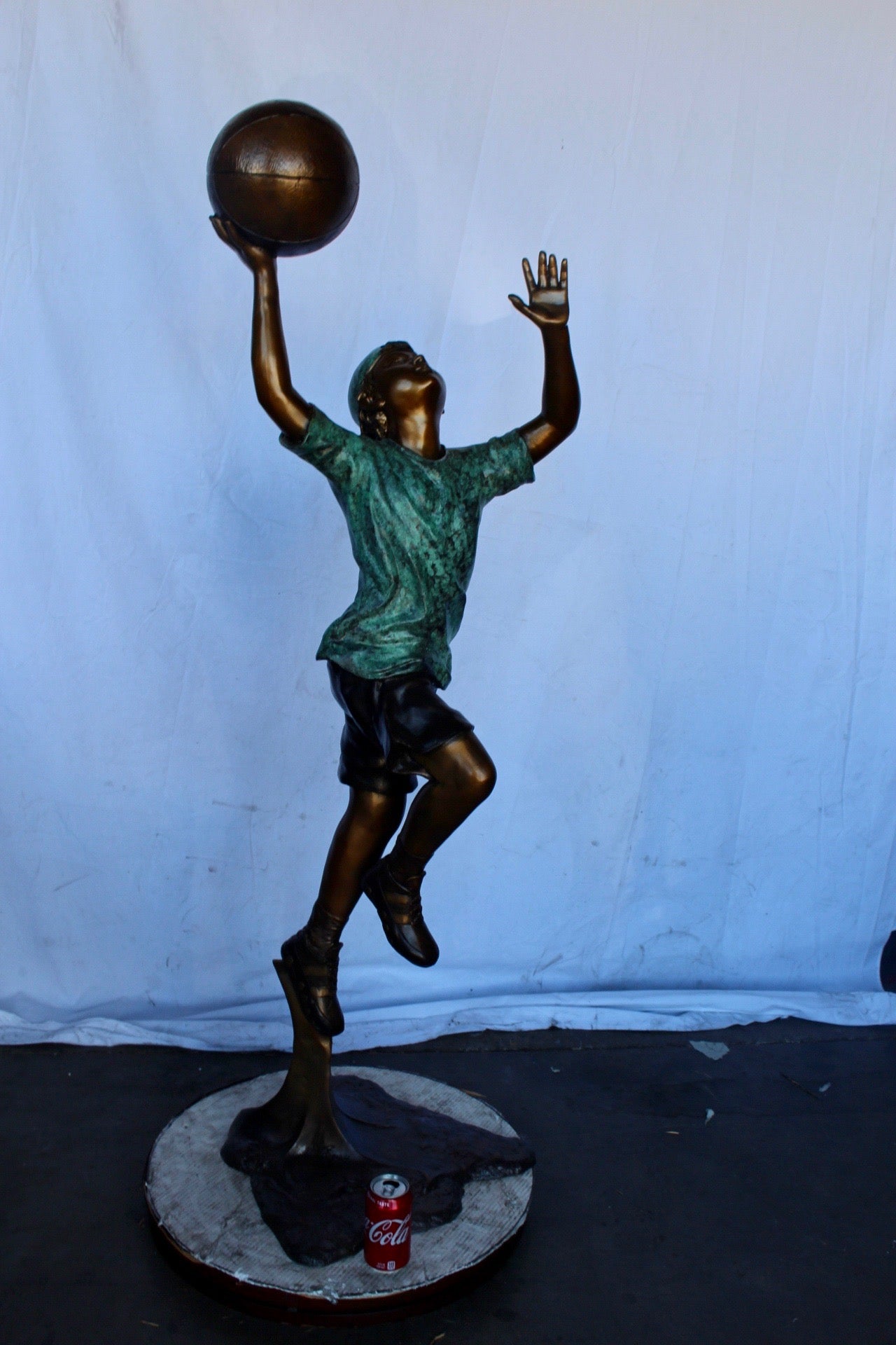A young boy scoring a basket bronze statue -  Size: 19"L x 20"W x 61"H.