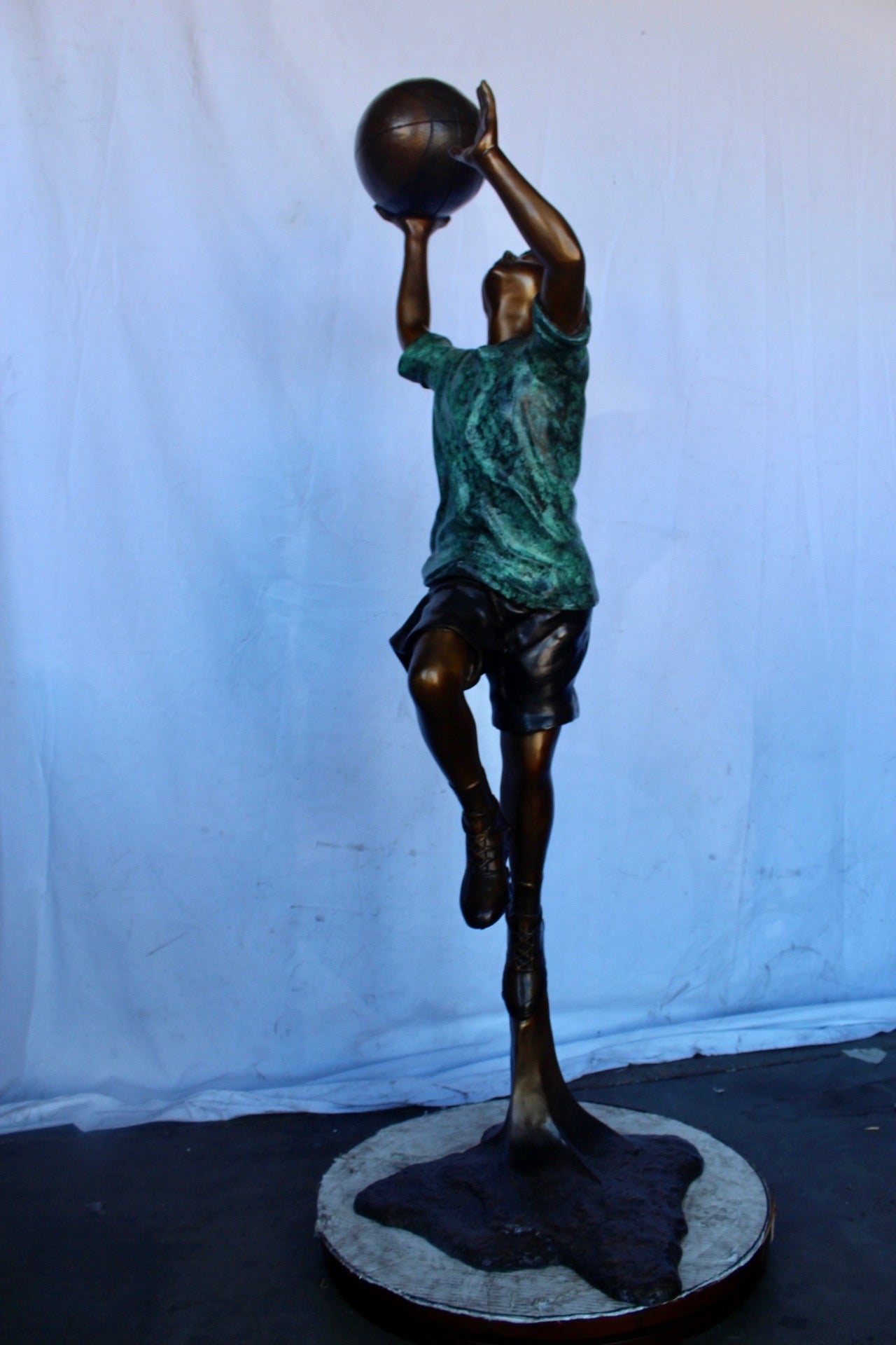 A young boy scoring a basket bronze statue -  Size: 19"L x 20"W x 61"H.