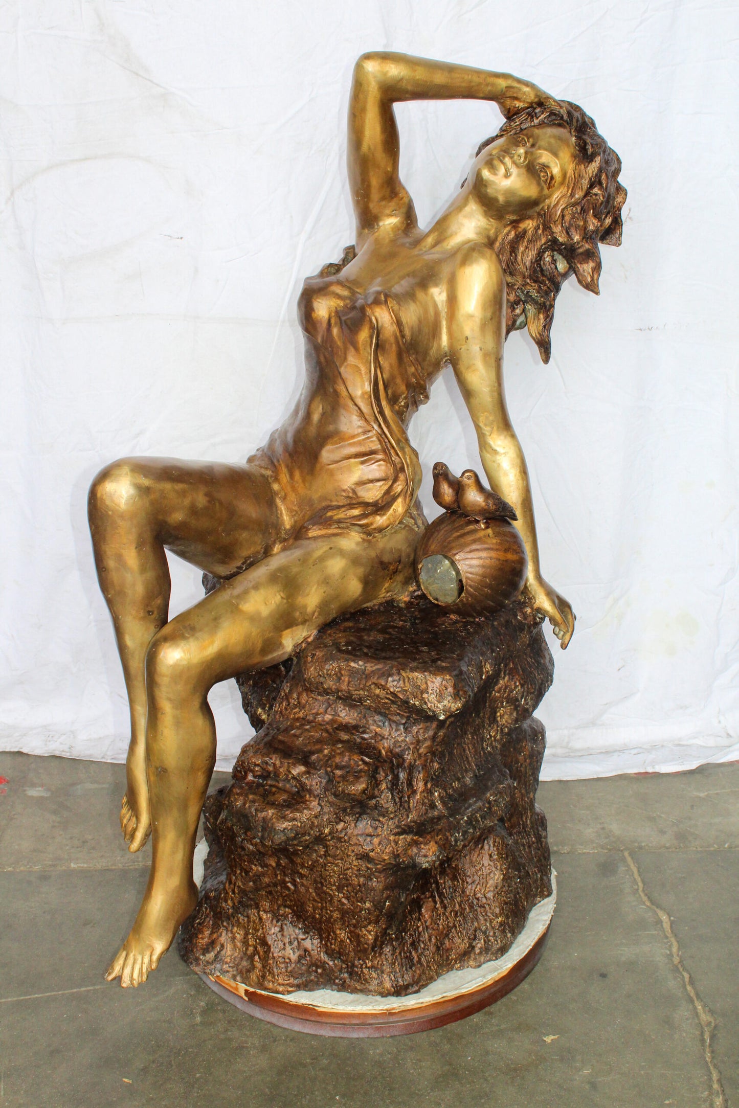 Bronze Outdoor Fountain of a Woman Relaxing on Rocks 49" x 39" x 50"H