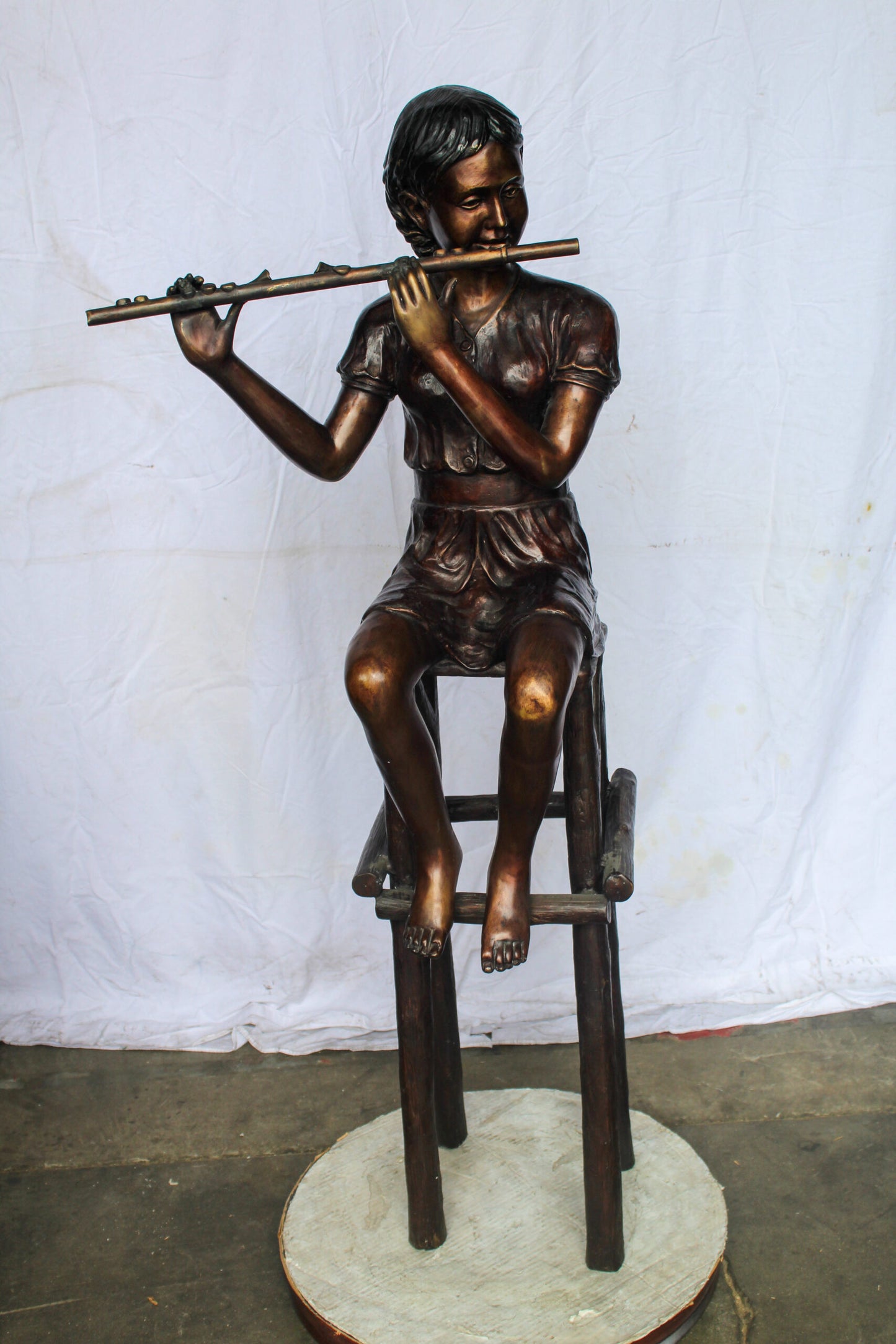 Young Girl Playing the Flute sitting on a Chair Bronze Statue 24" x 16" x 58"H
