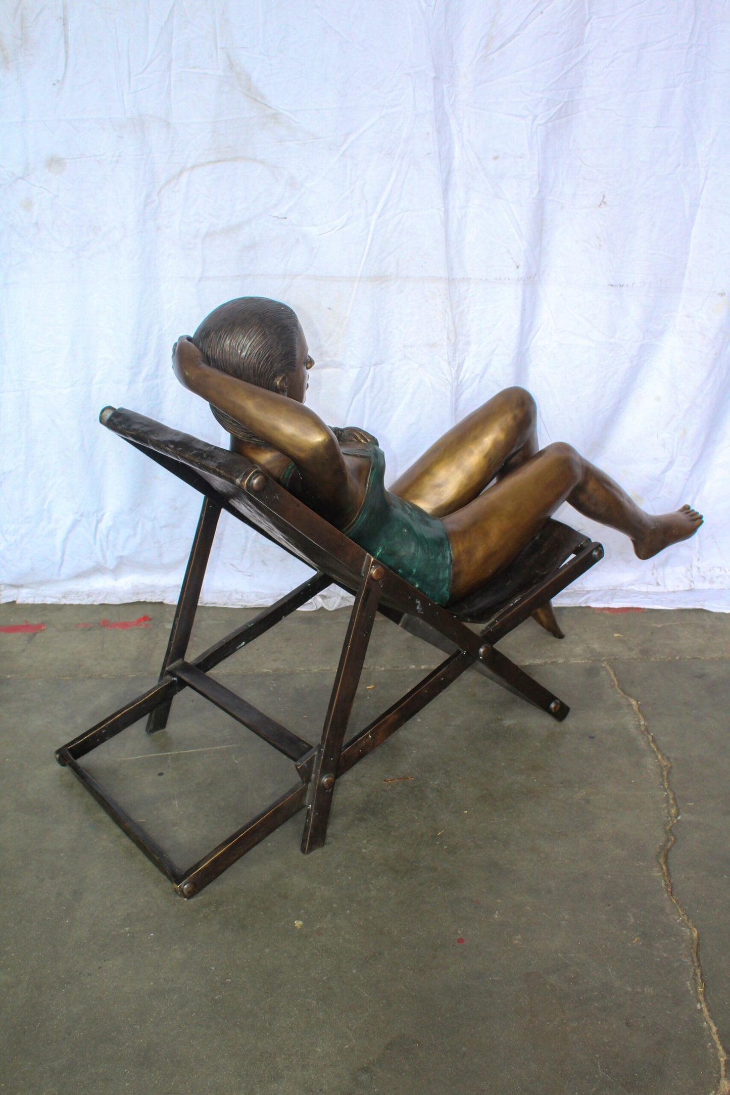 Life Size Bronze Statue of a Lady Sitting on a Beach Chair 64" x 25" x 38"H
