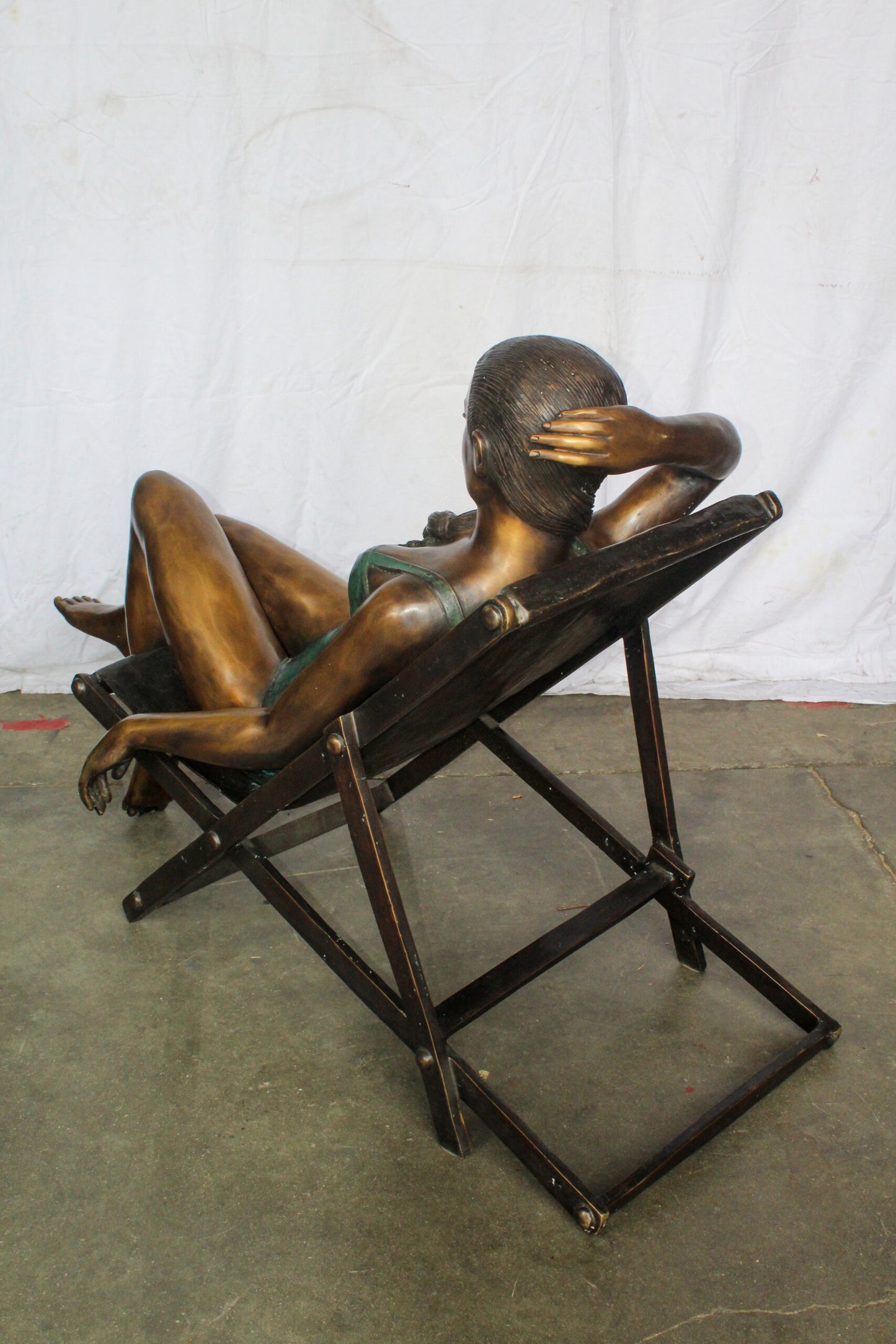 Life Size Bronze Statue of a Lady Sitting on a Beach Chair 64" x 25" x 38"H