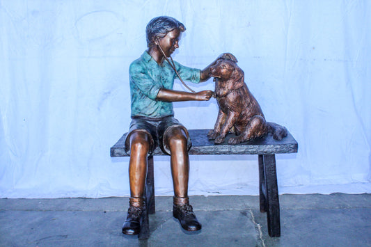 Boy Playing Veterinary Doctor with Dog on a Bench Bronze Statue 34" x 24" x 42"H