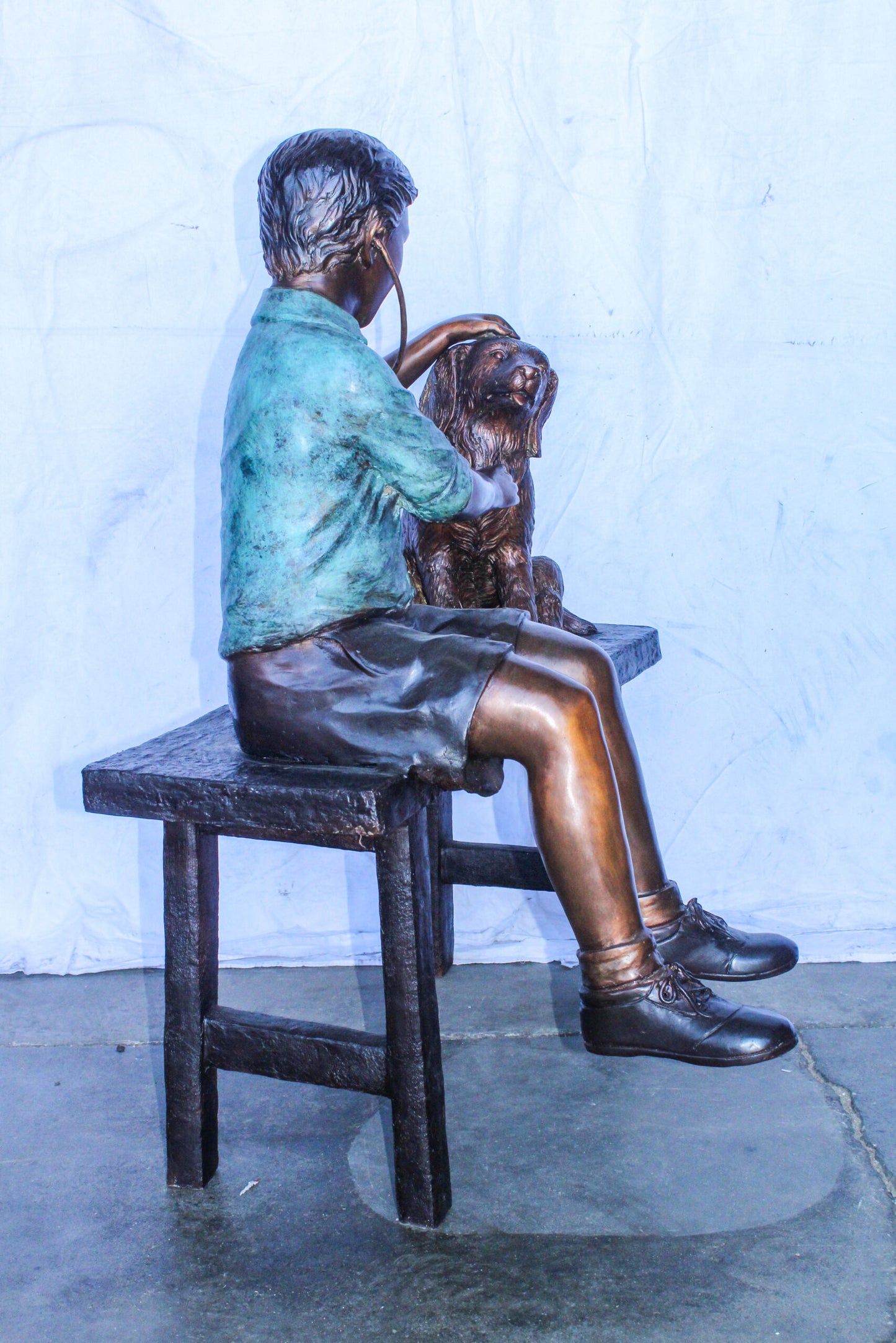 Boy Playing Veterinary Doctor with Dog on a Bench Bronze Statue 34" x 24" x 42"H