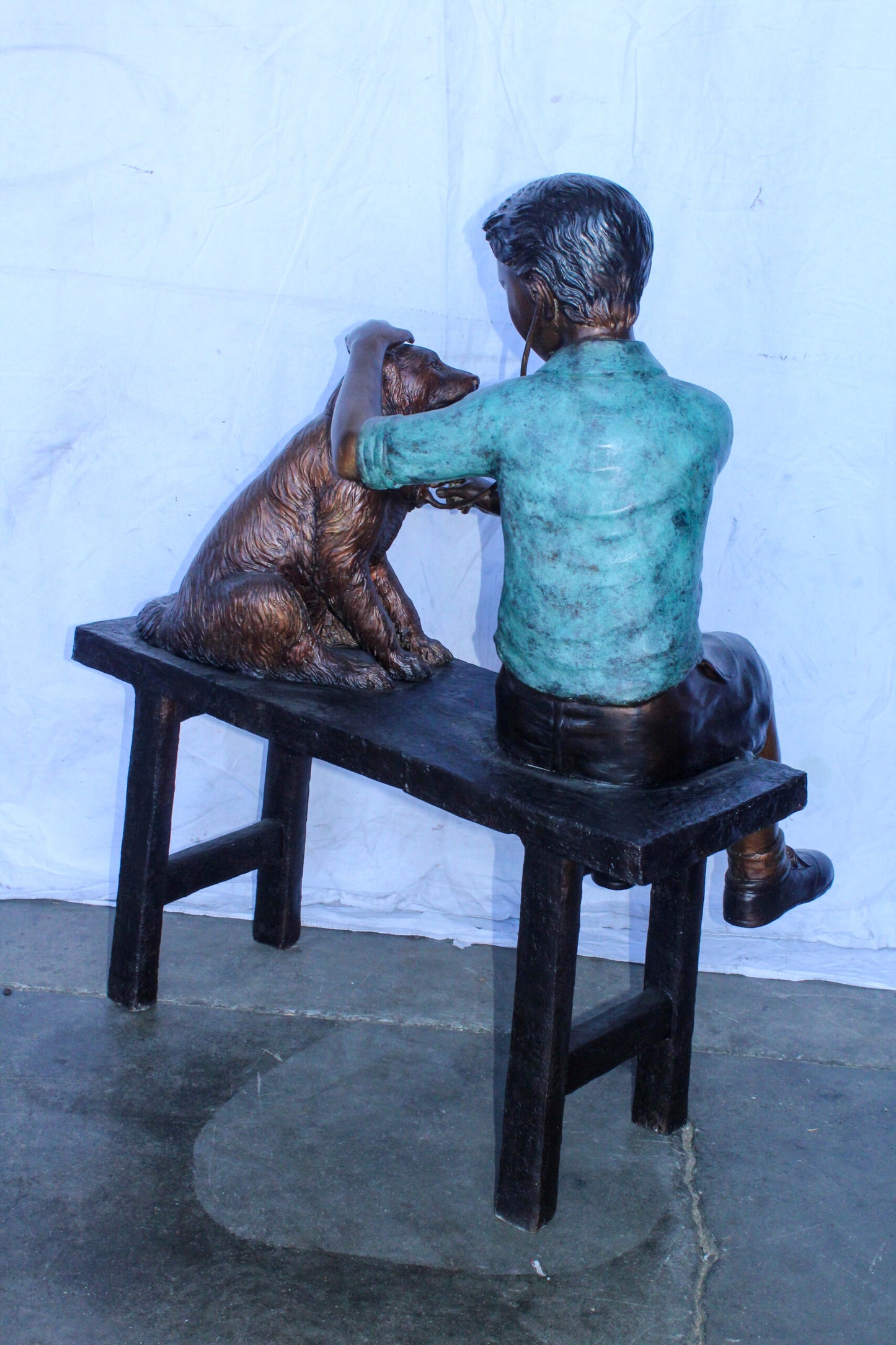 Boy Playing Veterinary Doctor with Dog on a Bench Bronze Statue 34" x 24" x 42"H