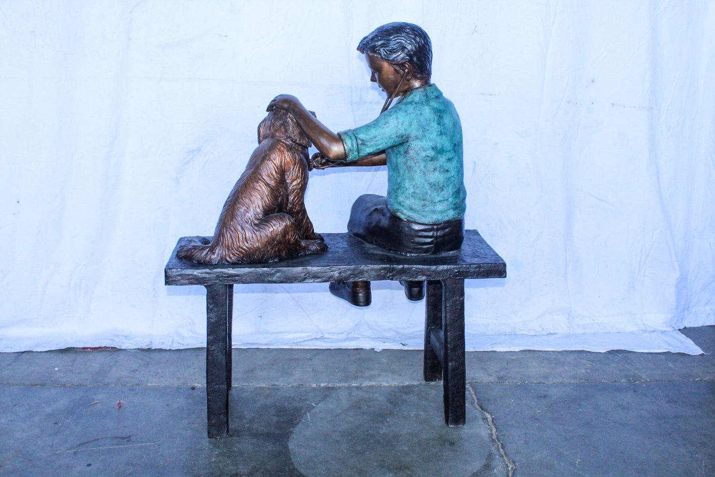 Boy Playing Veterinary Doctor with Dog on a Bench Bronze Statue 34" x 24" x 42"H