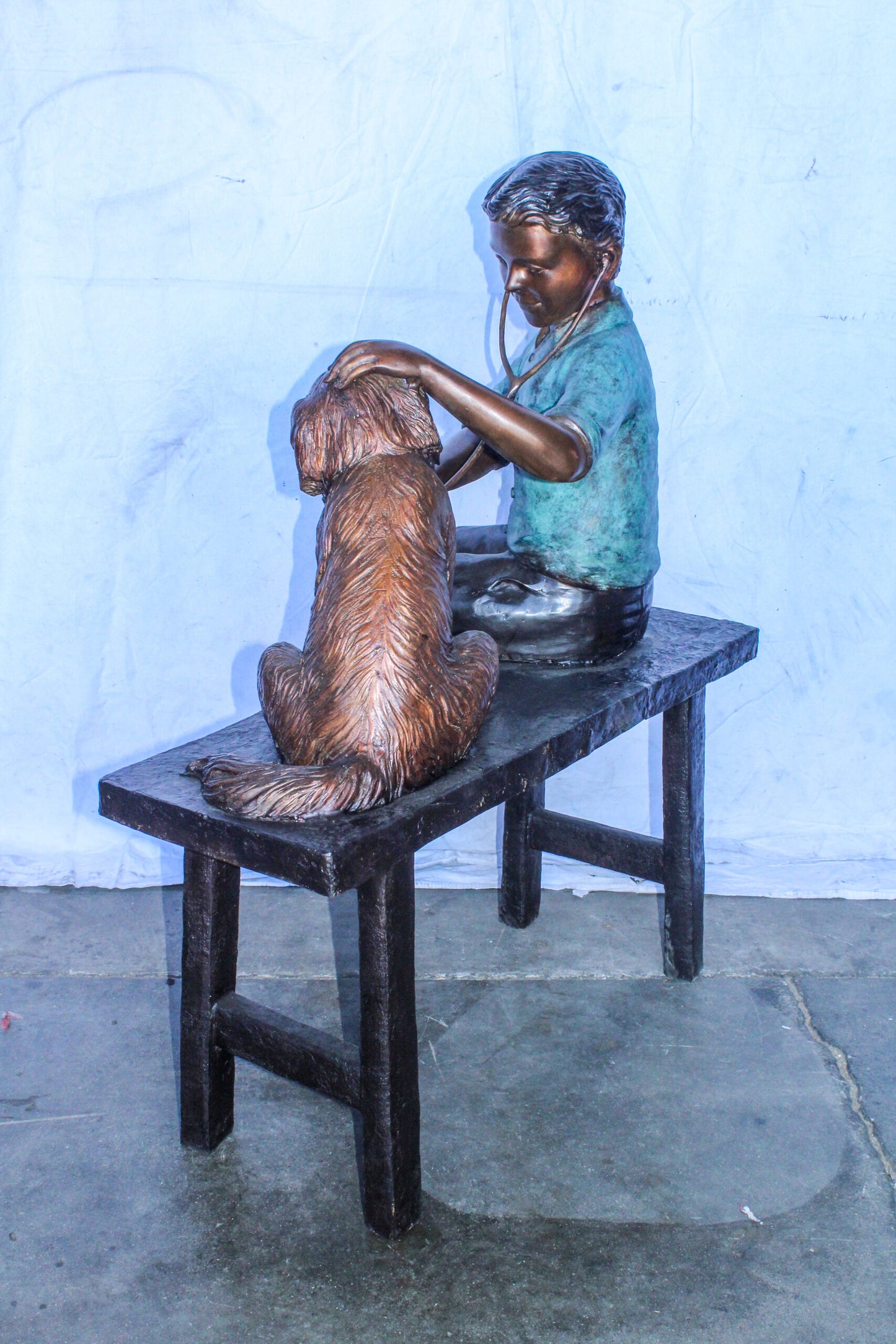 Boy Playing Veterinary Doctor with Dog on a Bench Bronze Statue 34" x 24" x 42"H