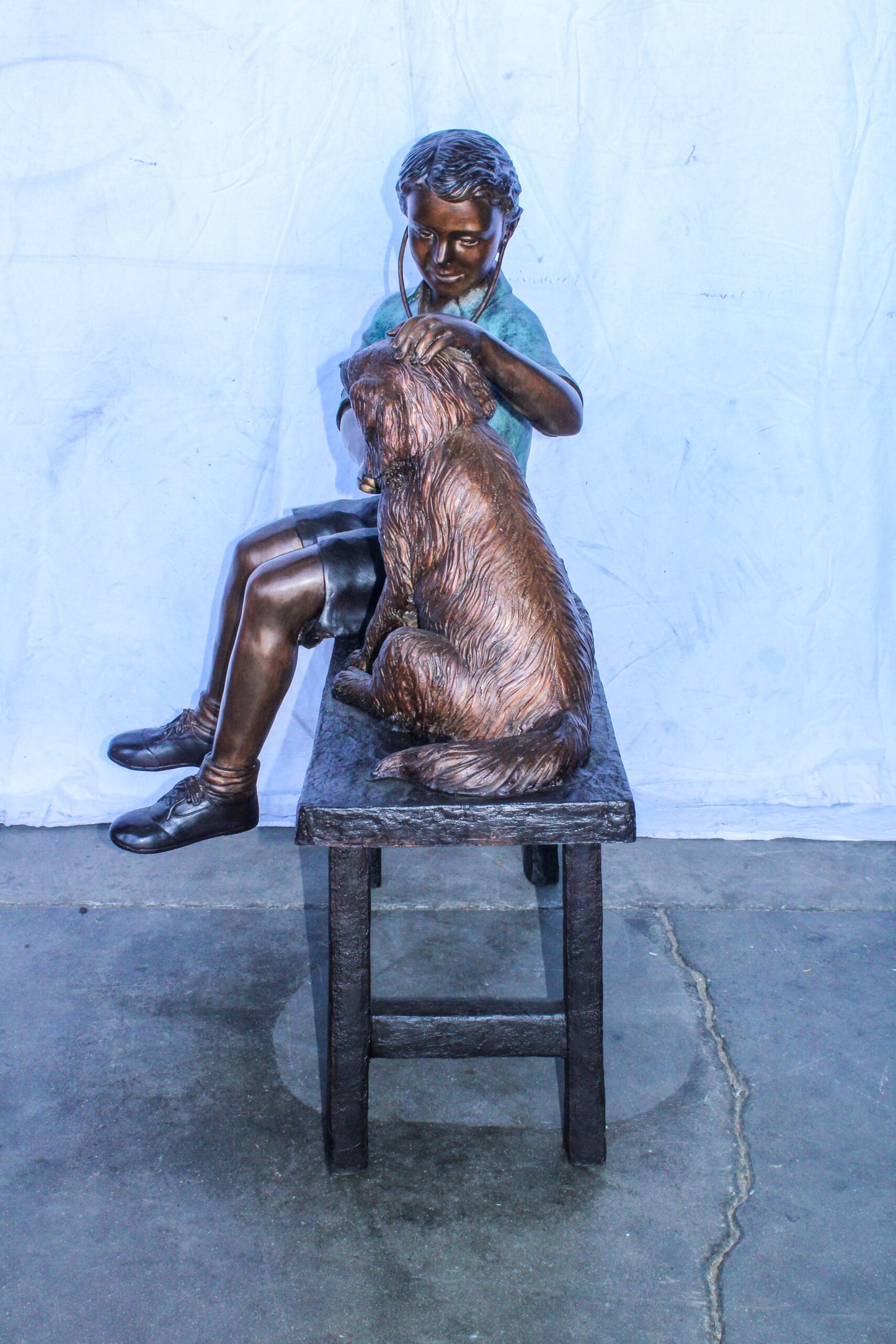 Boy Playing Veterinary Doctor with Dog on a Bench Bronze Statue 34" x 24" x 42"H