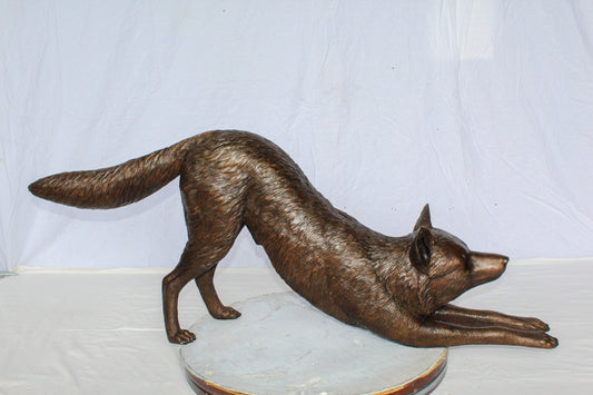 Nifao Bronze Wolf Stretching Statue – Handcrafted Lost Wax Wildlife Sculpture with Natural Patina Finish Long Lifelike Wolf Art for Rustic Cabin, Lodge Home Décor 49" x 10" x 20"H