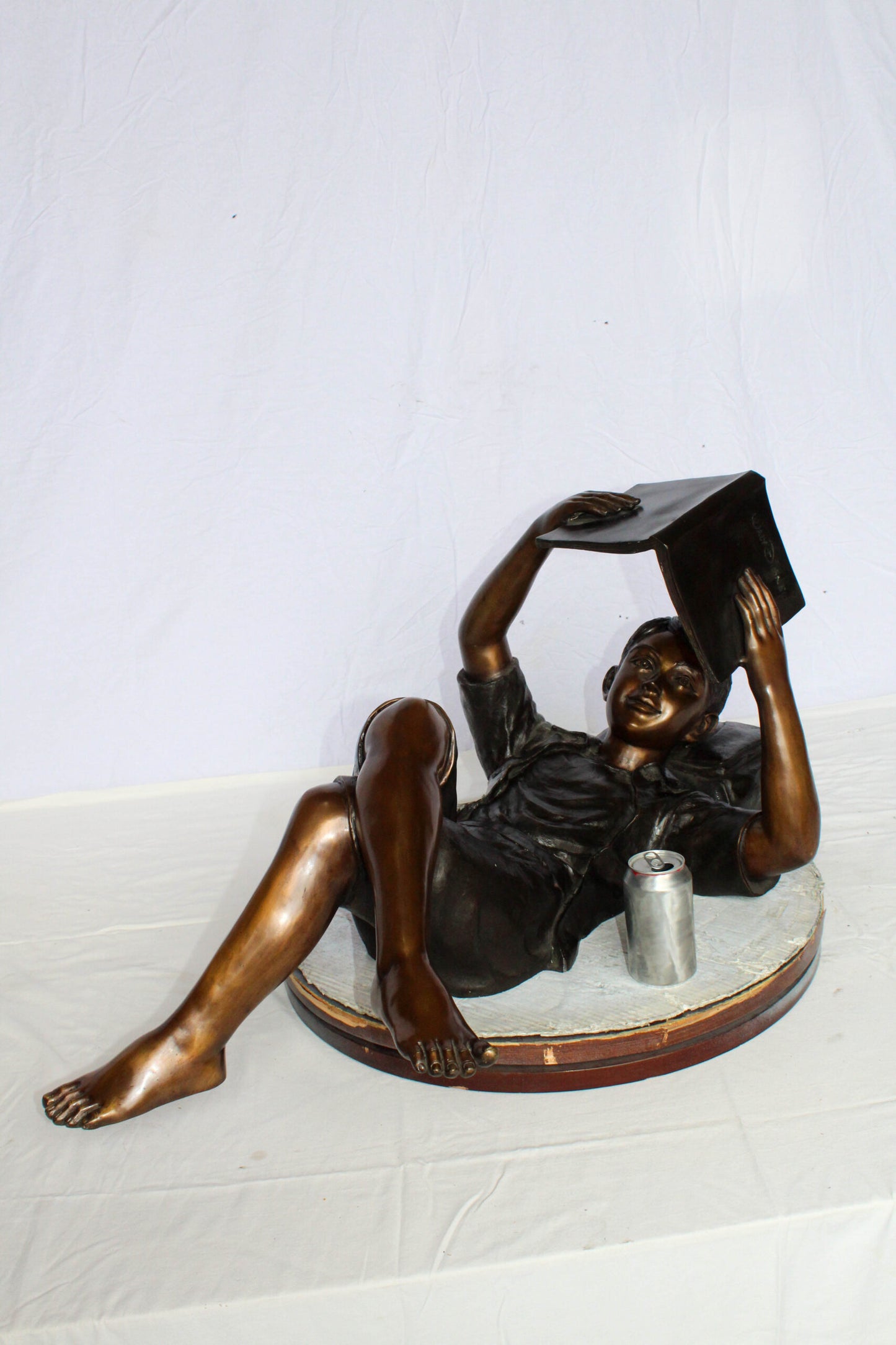 Nifao Bronze Boy Reading Statue – Large Handcrafted Lost Wax Sculpture of Young Boy Lying Back with Book – Detailed Child Figurine for Study, Library, Garden, or Home Déco 41" x 22" x 18"H