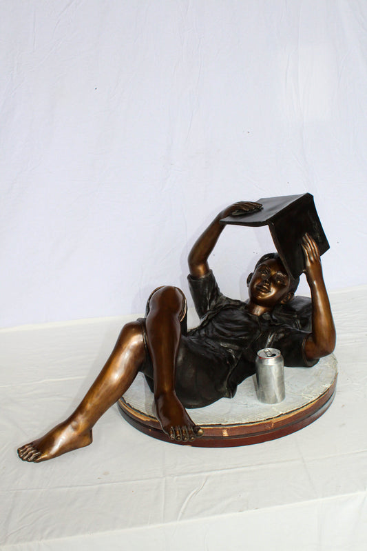 Nifao Bronze Boy Reading Statue – Large Handcrafted Lost Wax Sculpture of Young Boy Lying Back with Book – Detailed Child Figurine for Study, Library, Garden, or Home Déco 41" x 22" x 18"H
