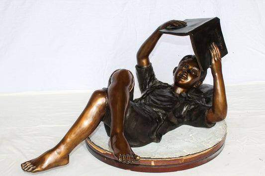 Nifao Bronze Boy Reading Statue – Large Handcrafted Lost Wax Sculpture of Young Boy Lying Back with Book – Detailed Child Figurine for Study, Library, Garden, or Home Déco 41" x 22" x 18"H