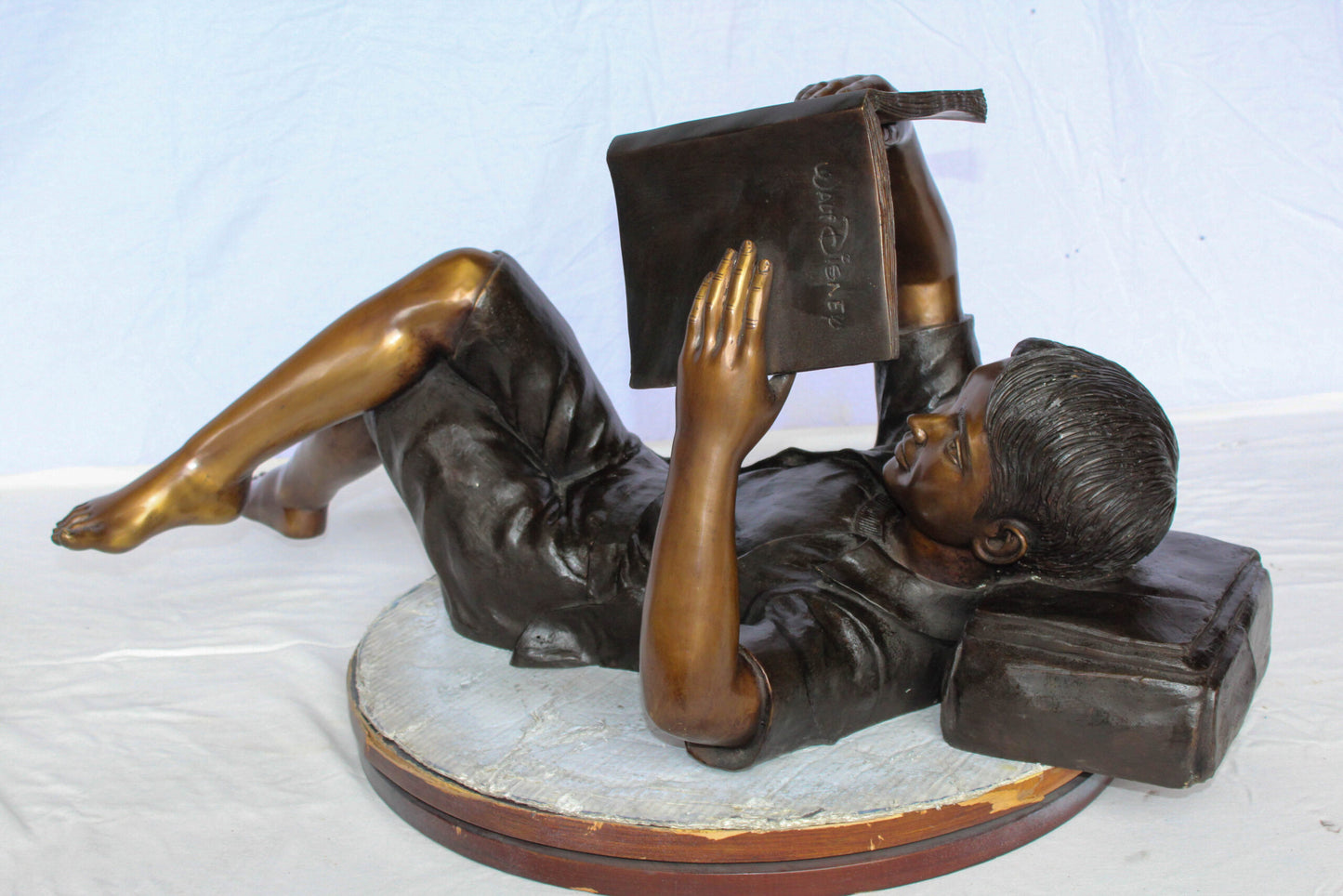 Nifao Bronze Boy Reading Statue – Large Handcrafted Lost Wax Sculpture of Young Boy Lying Back with Book – Detailed Child Figurine for Study, Library, Garden, or Home Déco 41" x 22" x 18"H