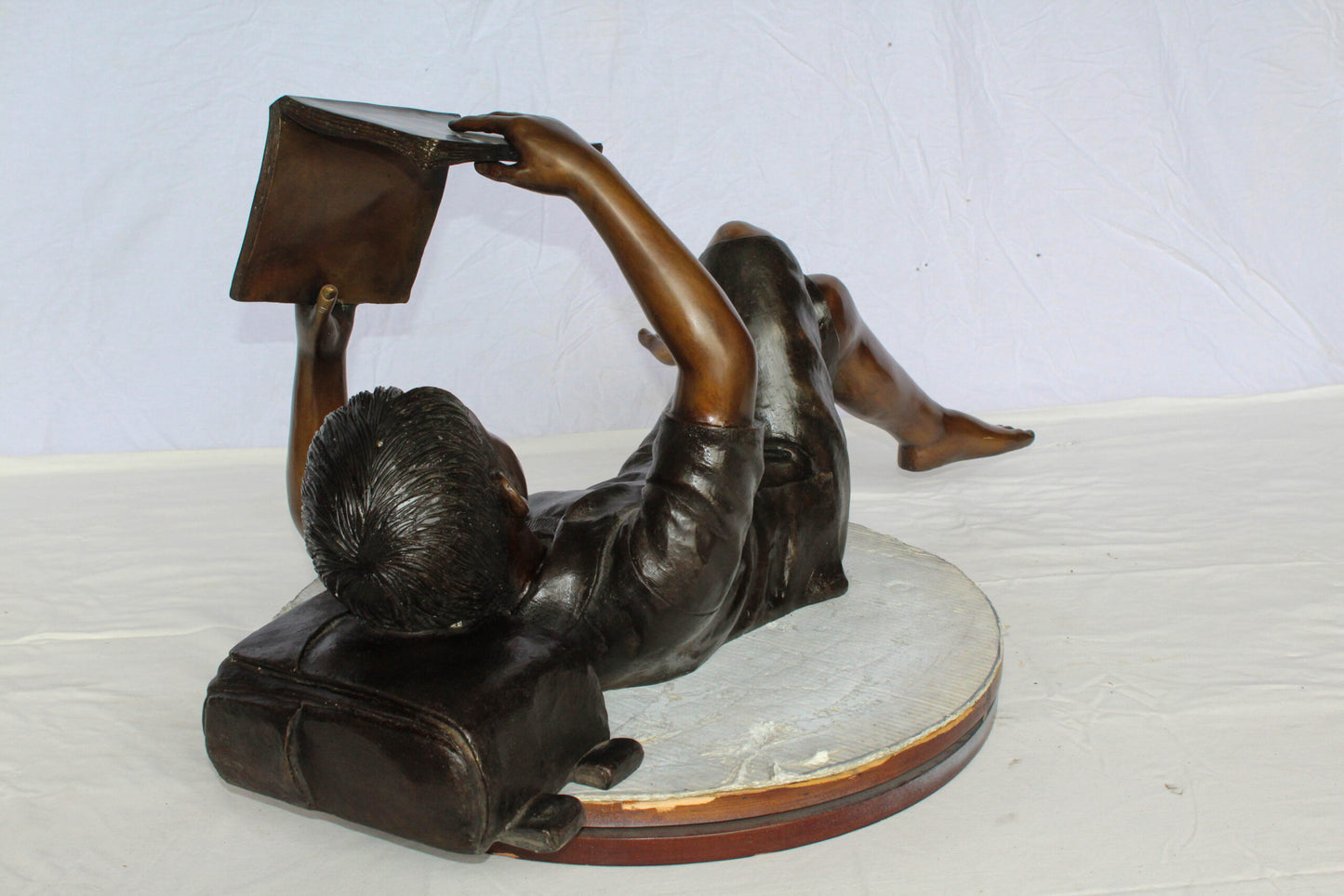 Nifao Bronze Boy Reading Statue – Large Handcrafted Lost Wax Sculpture of Young Boy Lying Back with Book – Detailed Child Figurine for Study, Library, Garden, or Home Déco 41" x 22" x 18"H