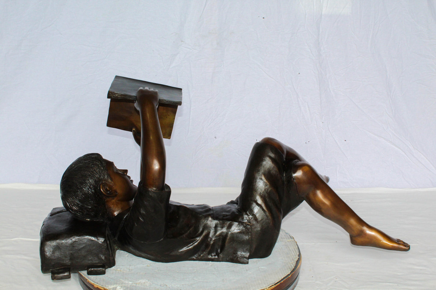 Nifao Bronze Boy Reading Statue – Large Handcrafted Lost Wax Sculpture of Young Boy Lying Back with Book – Detailed Child Figurine for Study, Library, Garden, or Home Déco 41" x 22" x 18"H