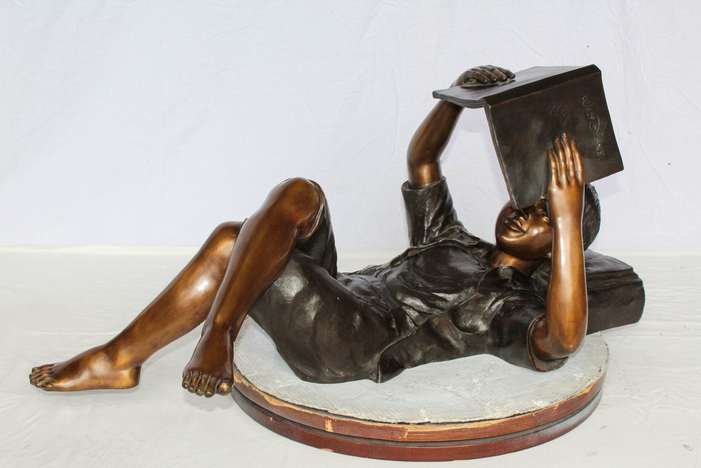 Nifao Bronze Boy Reading Statue – Large Handcrafted Lost Wax Sculpture of Young Boy Lying Back with Book – Detailed Child Figurine for Study, Library, Garden, or Home Déco 41" x 22" x 18"H