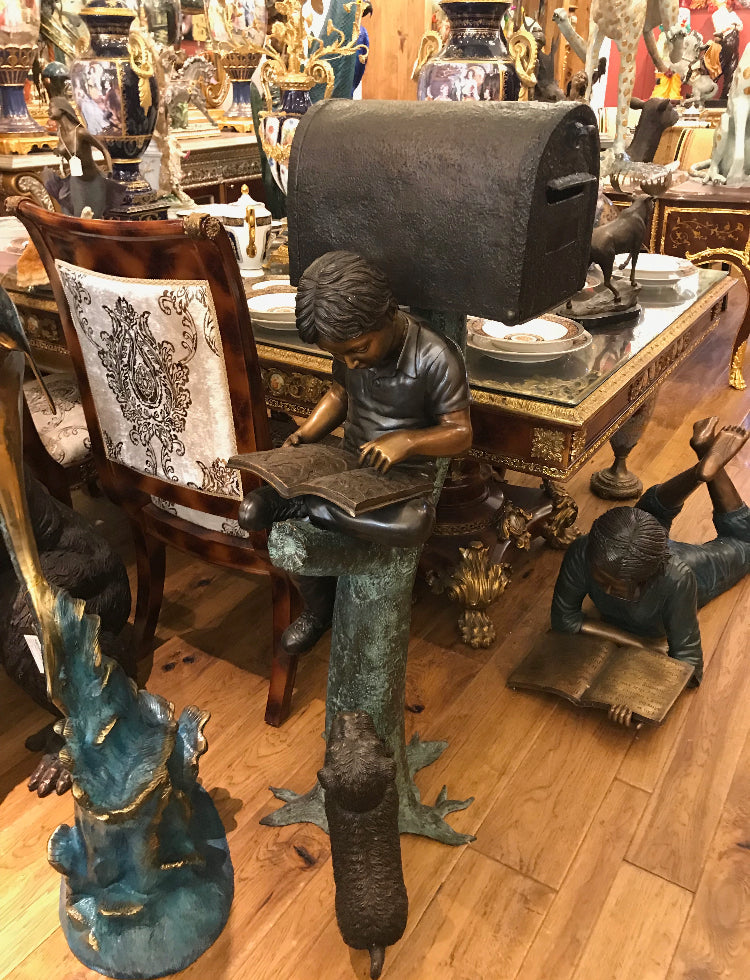 Boy Sitting by a Mailbox reading a book Bronze Statue - 16"L x 20"W x 50"H.