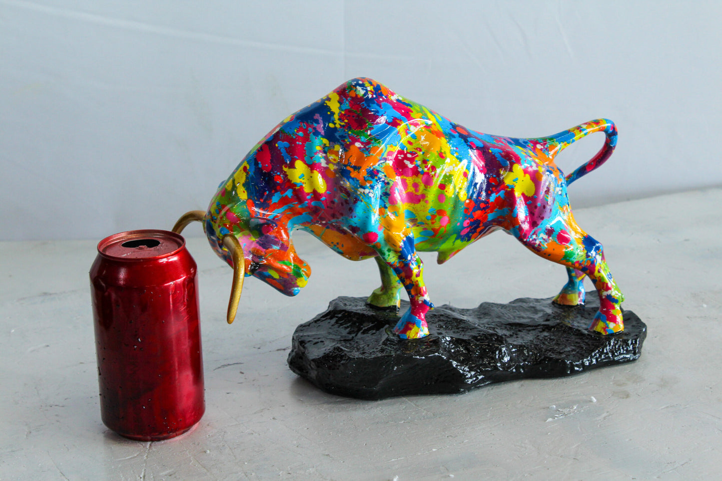 Nifao Resin Bull Statue – Colorful Indoor/Outdoor Charging Bull Sculpture, Vibrant Splatter Art Finish with Gold Horns, Modern Pop Art Animal Figurine for Homes, Offices & Gallery Decor 14" x 4" x 9"H