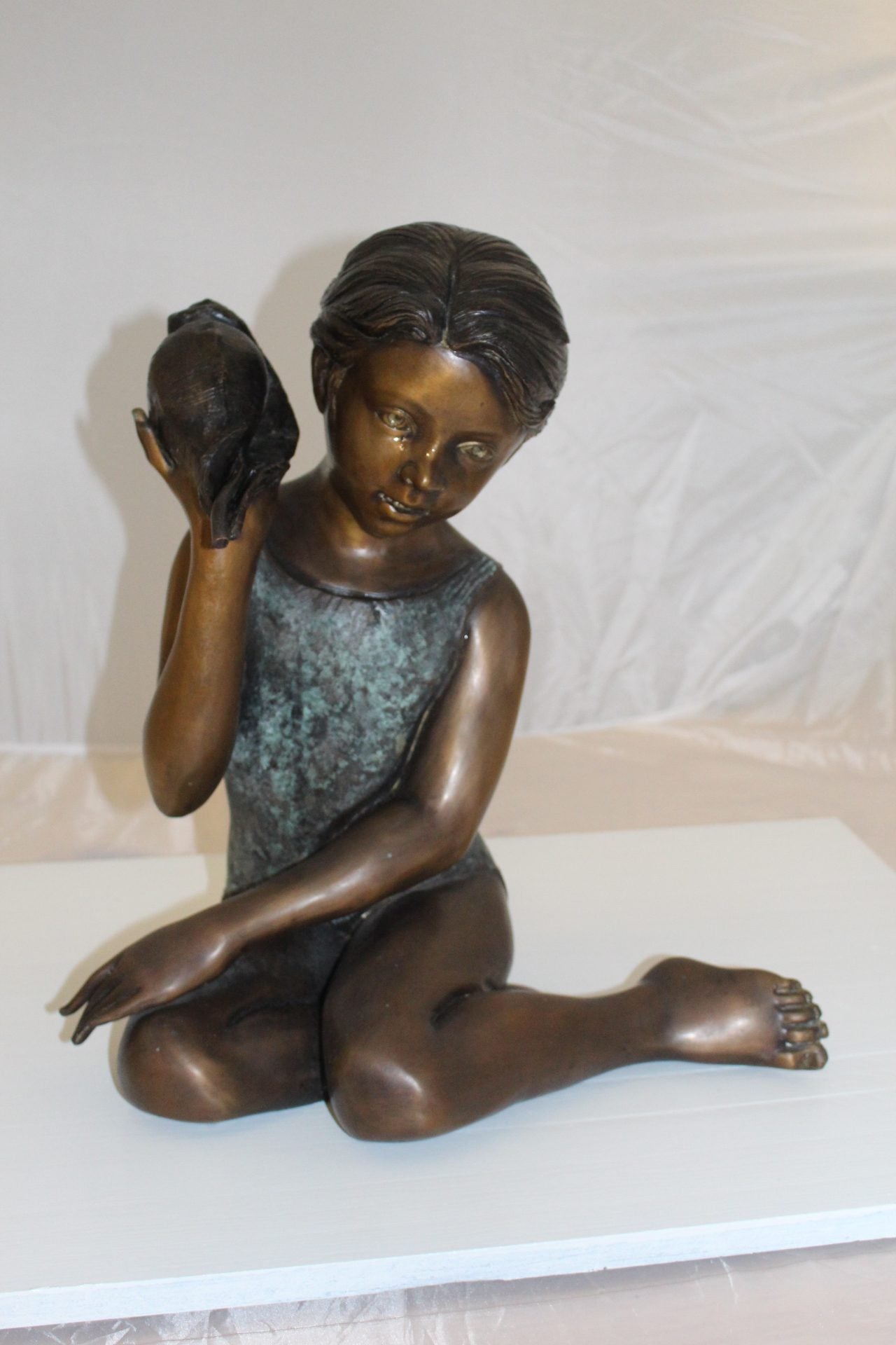 Girl listening to a Shell fountain-Bronze Statue - Size: 17"L x 10"W x 20"H.
