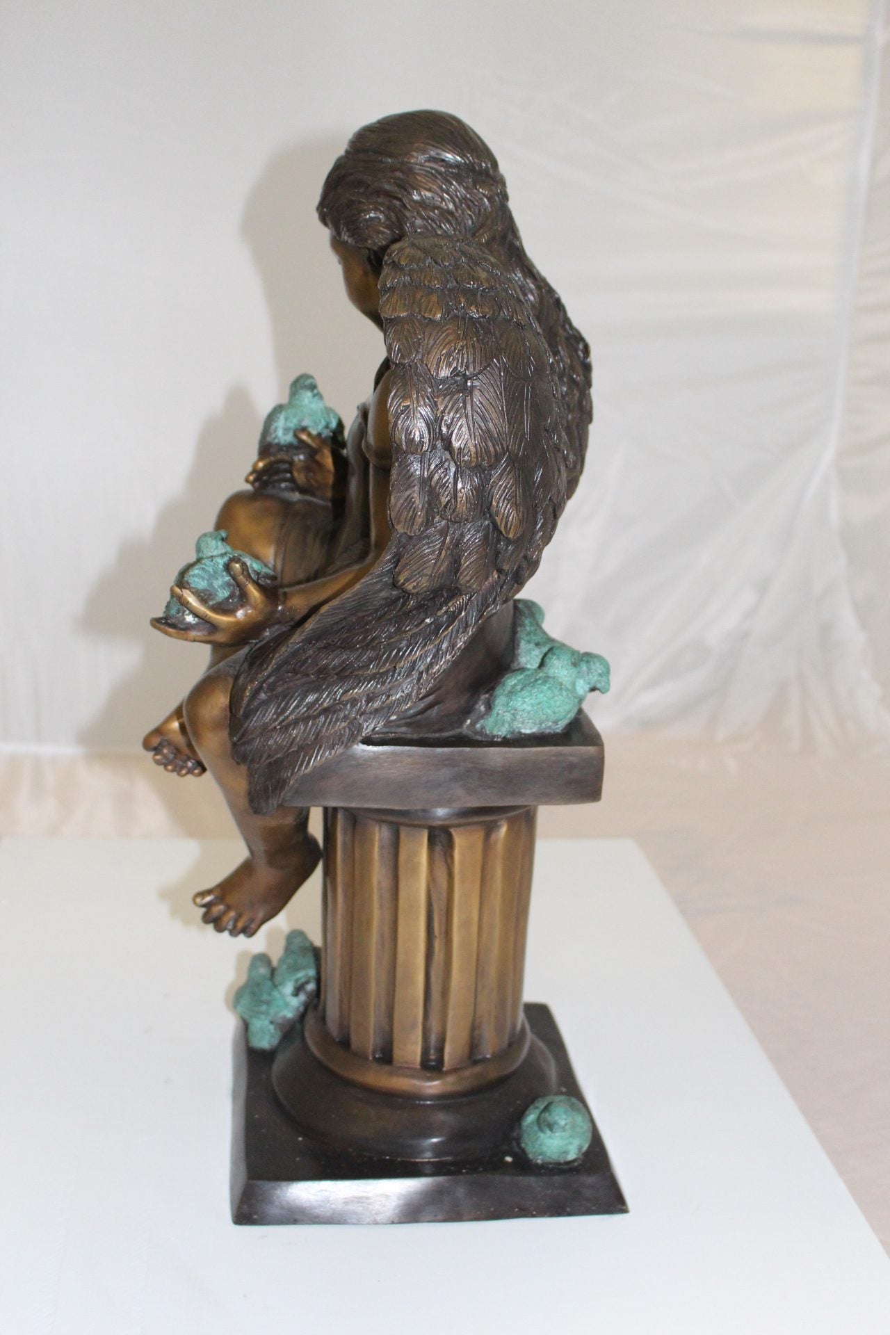 Angel sitting on Column Bronze Statue - Size: 10"L x 9"W x 22"H.