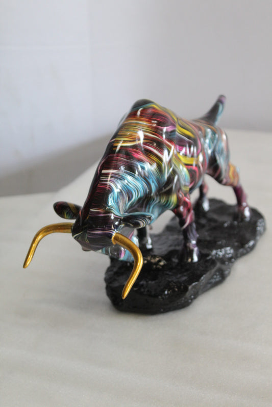 Nifao Resin Bull Statue- Multicolor Swirl Indoor/Outdoor Charging Bull Sculpture,Abstract Yellow,Blue,Red &Violet Design with Gold Horns on Glossy Black Base for Homes, Offices 14" x 4" x 9"H