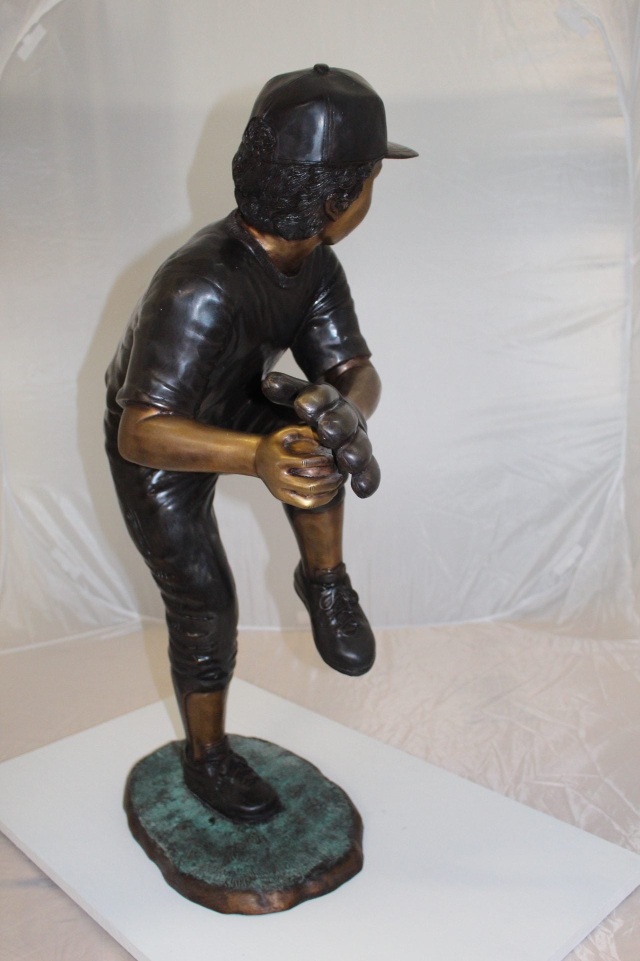 Boy plays baseball Bronze Statue - Size: 22"L x 12"W x 36"H.