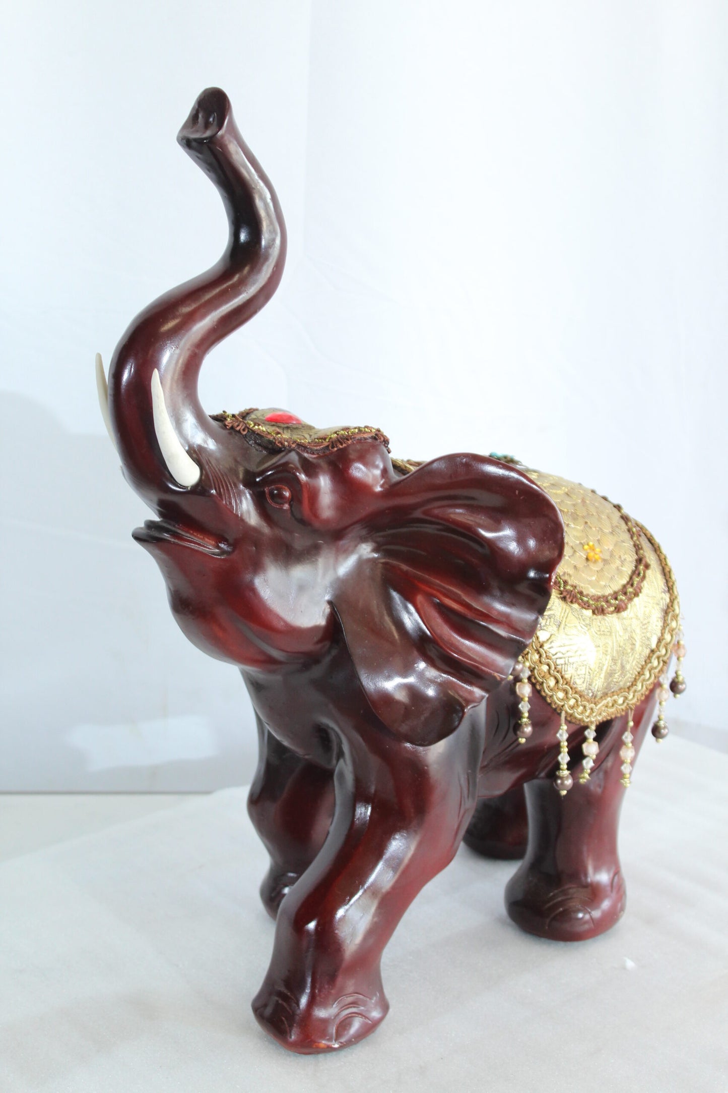 Resin Elephant Statue with Gold Saddle and Raised Trunk 19" x 10" x 22"H
