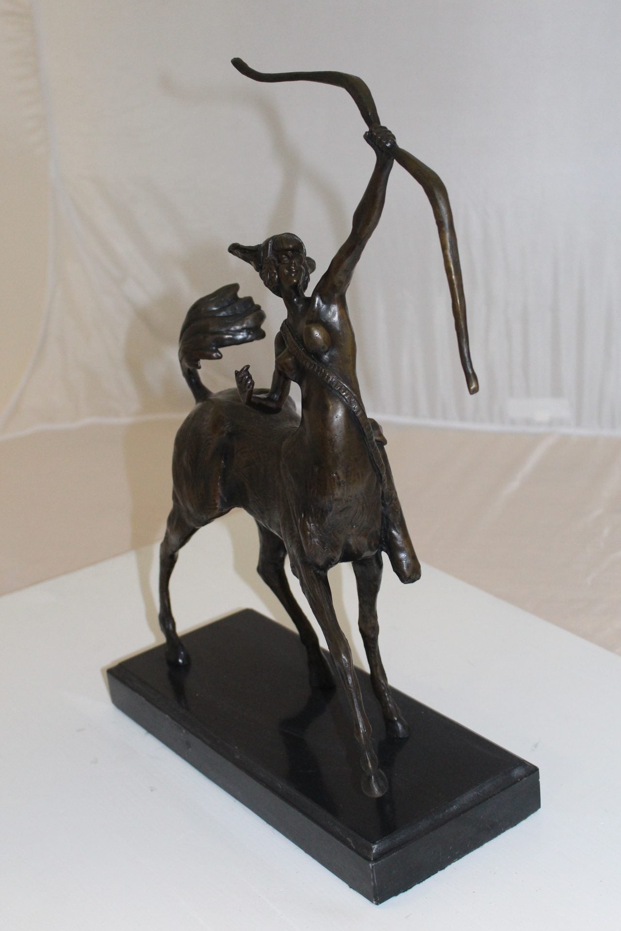 horse woman shooting an arrow Bronze Statue - Size: 14"L x 6"W x 20"H.
