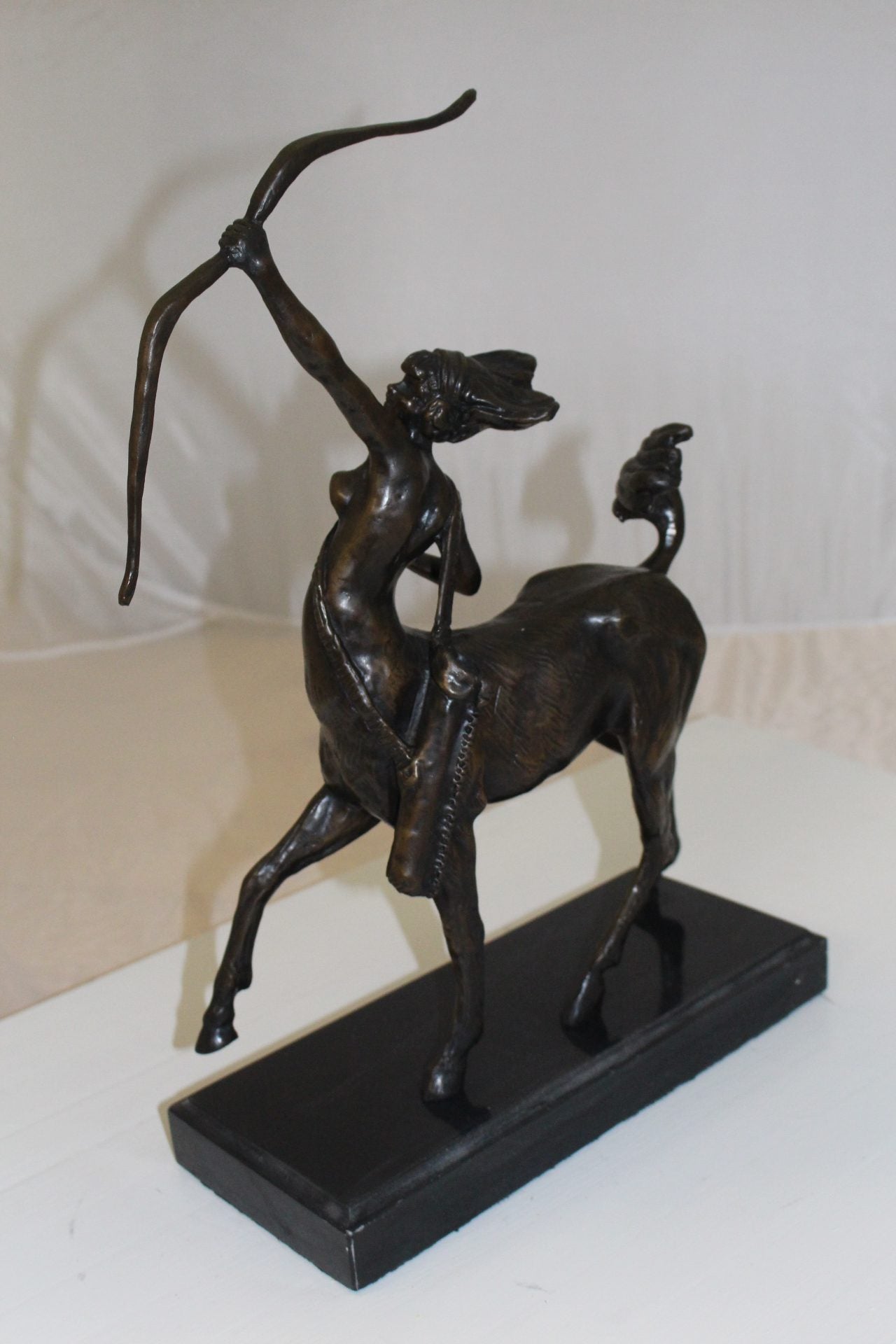 horse woman shooting an arrow Bronze Statue - Size: 14"L x 6"W x 20"H.