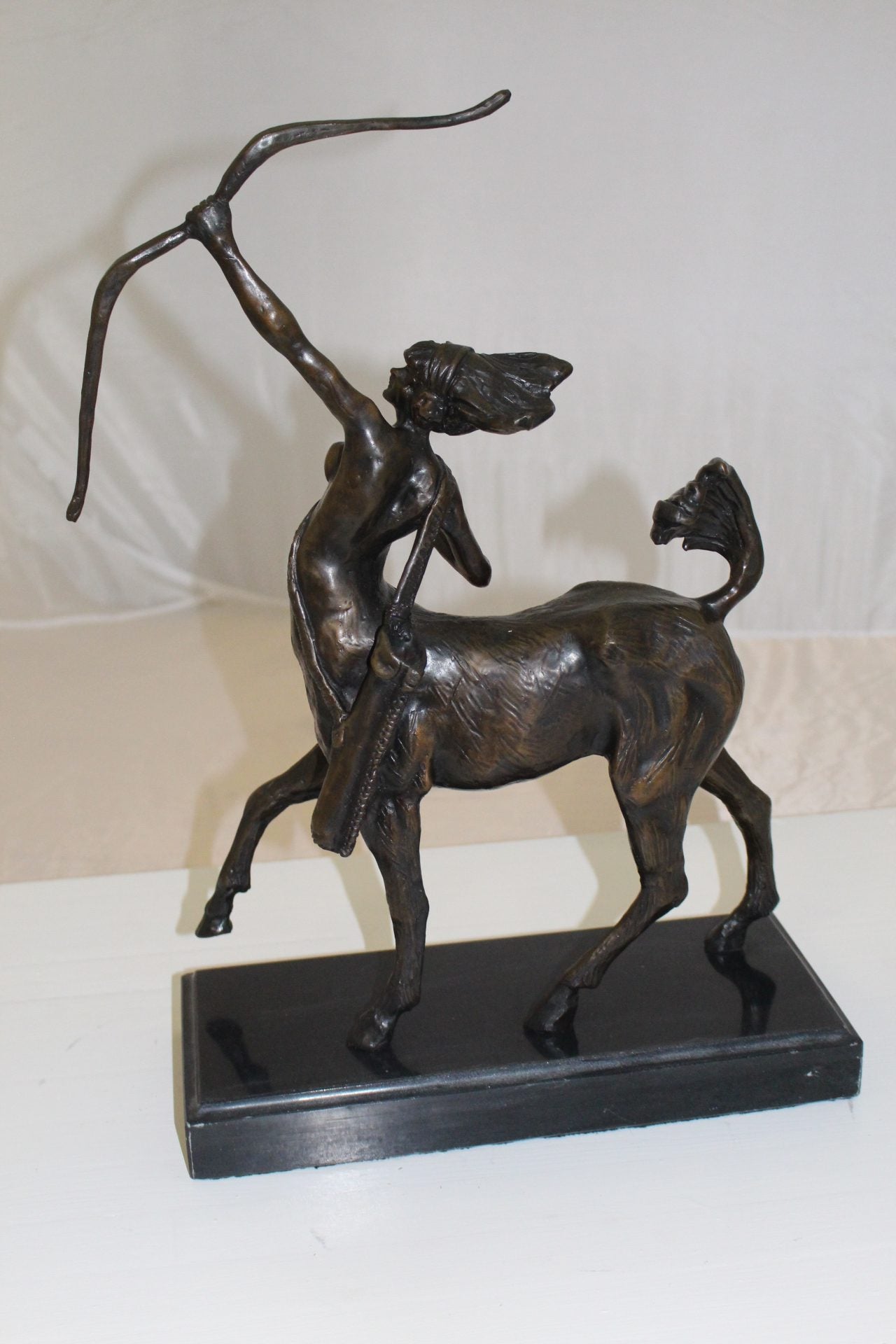 horse woman shooting an arrow Bronze Statue - Size: 14"L x 6"W x 20"H.