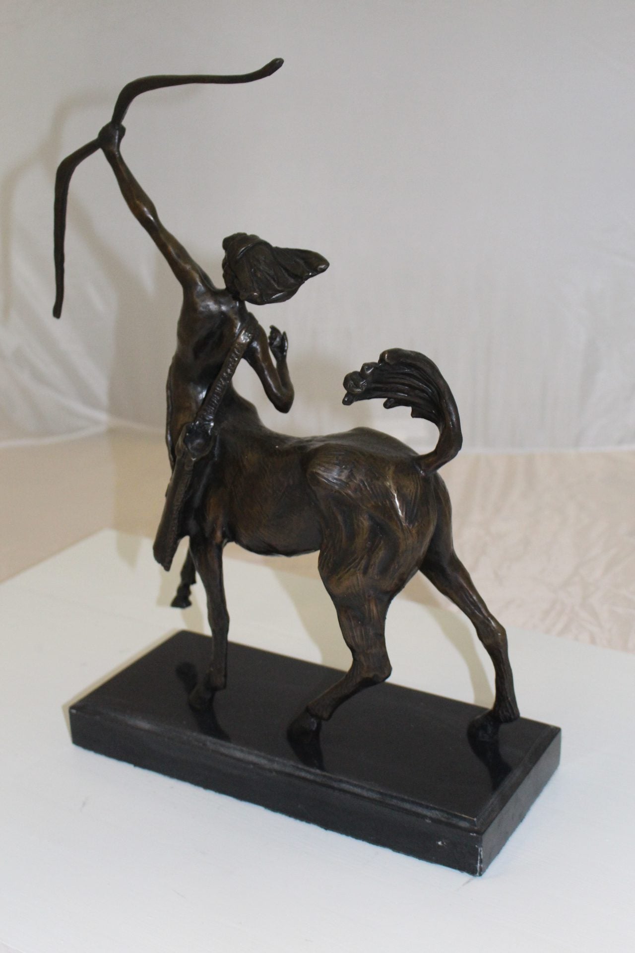 horse woman shooting an arrow Bronze Statue - Size: 14"L x 6"W x 20"H.