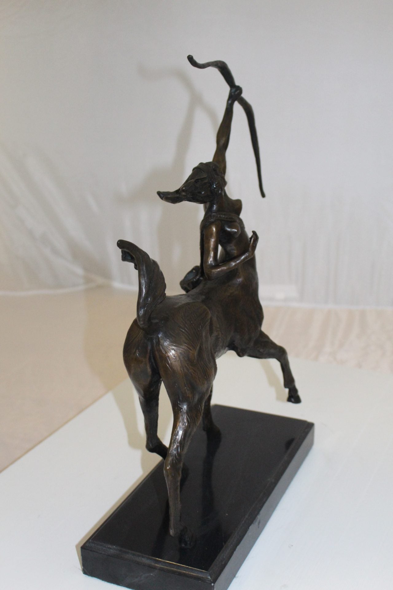 horse woman shooting an arrow Bronze Statue - Size: 14"L x 6"W x 20"H.